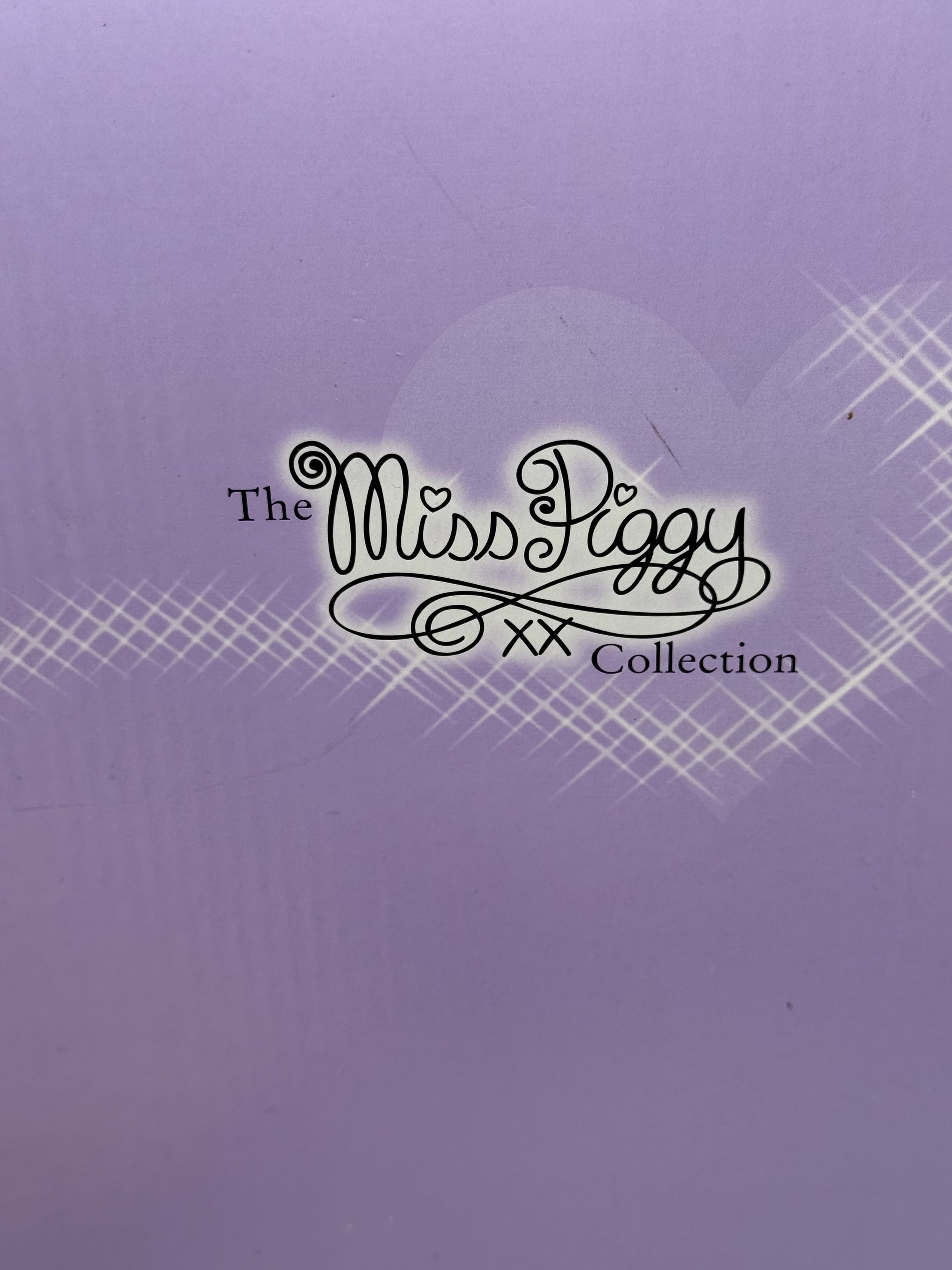 The Miss Piggy Collection logo on the lavender box