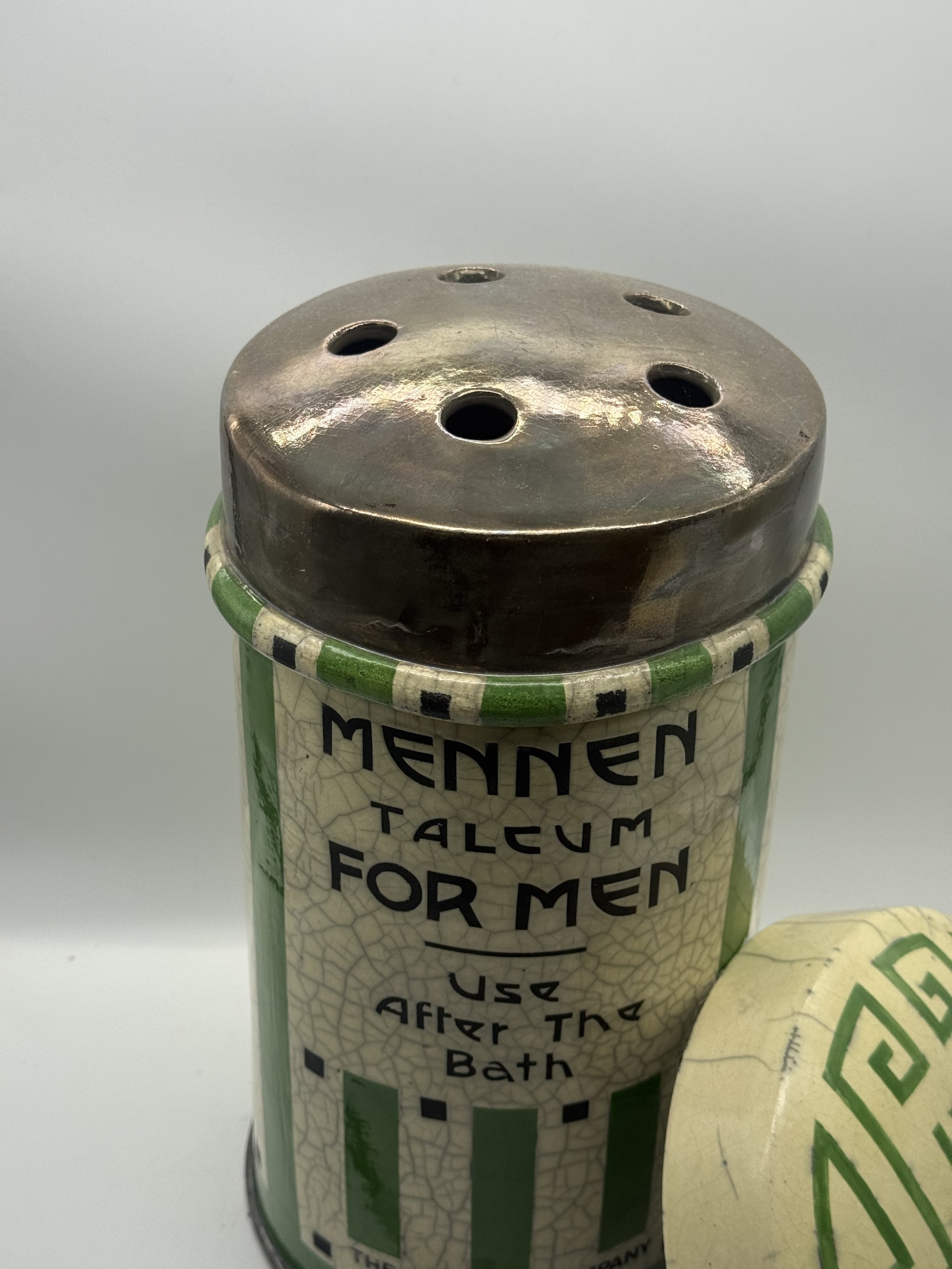 Close-up of the Mennen Talcum for Men label and shaker top