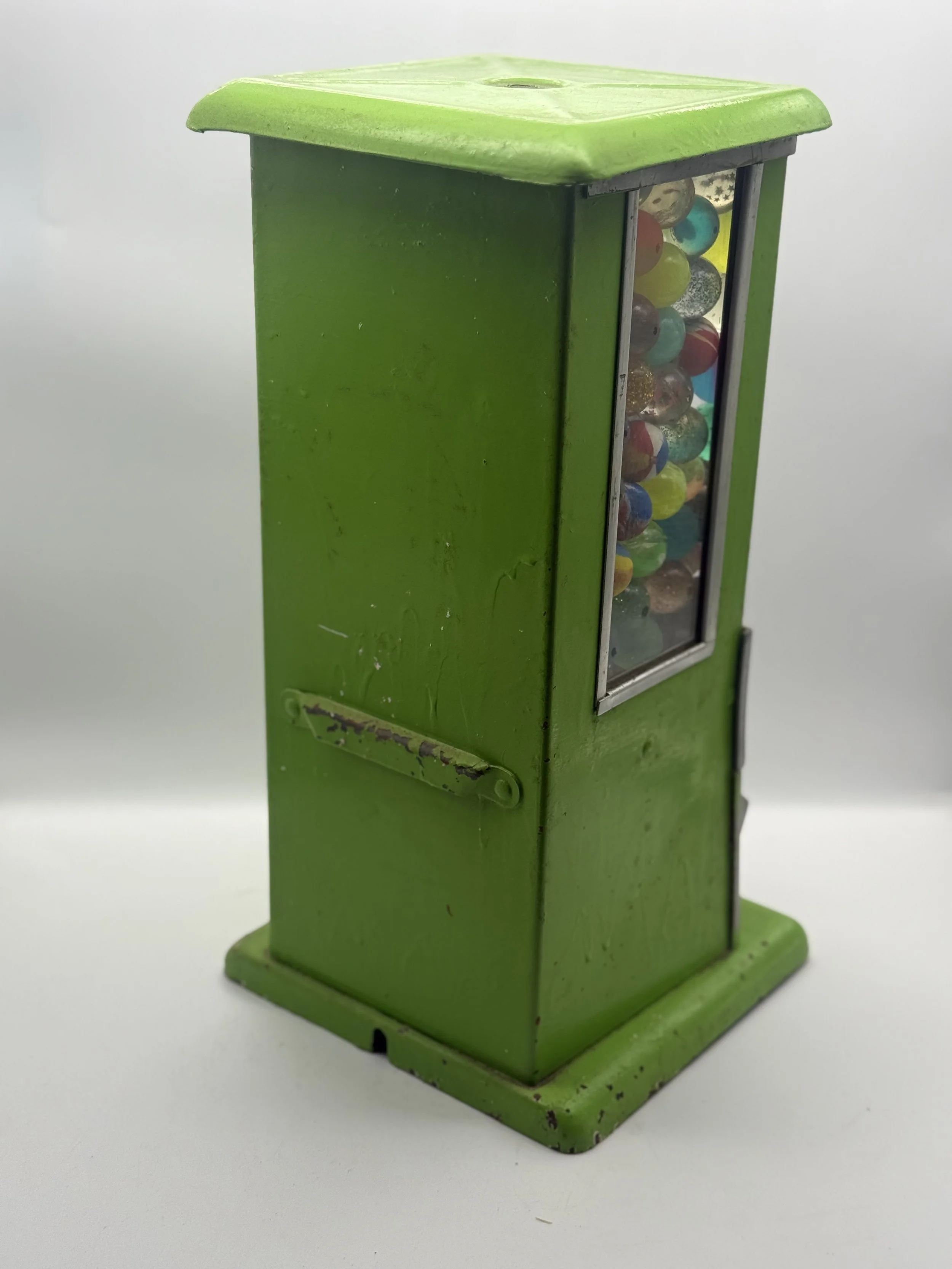 Back of the green Master gumball machine