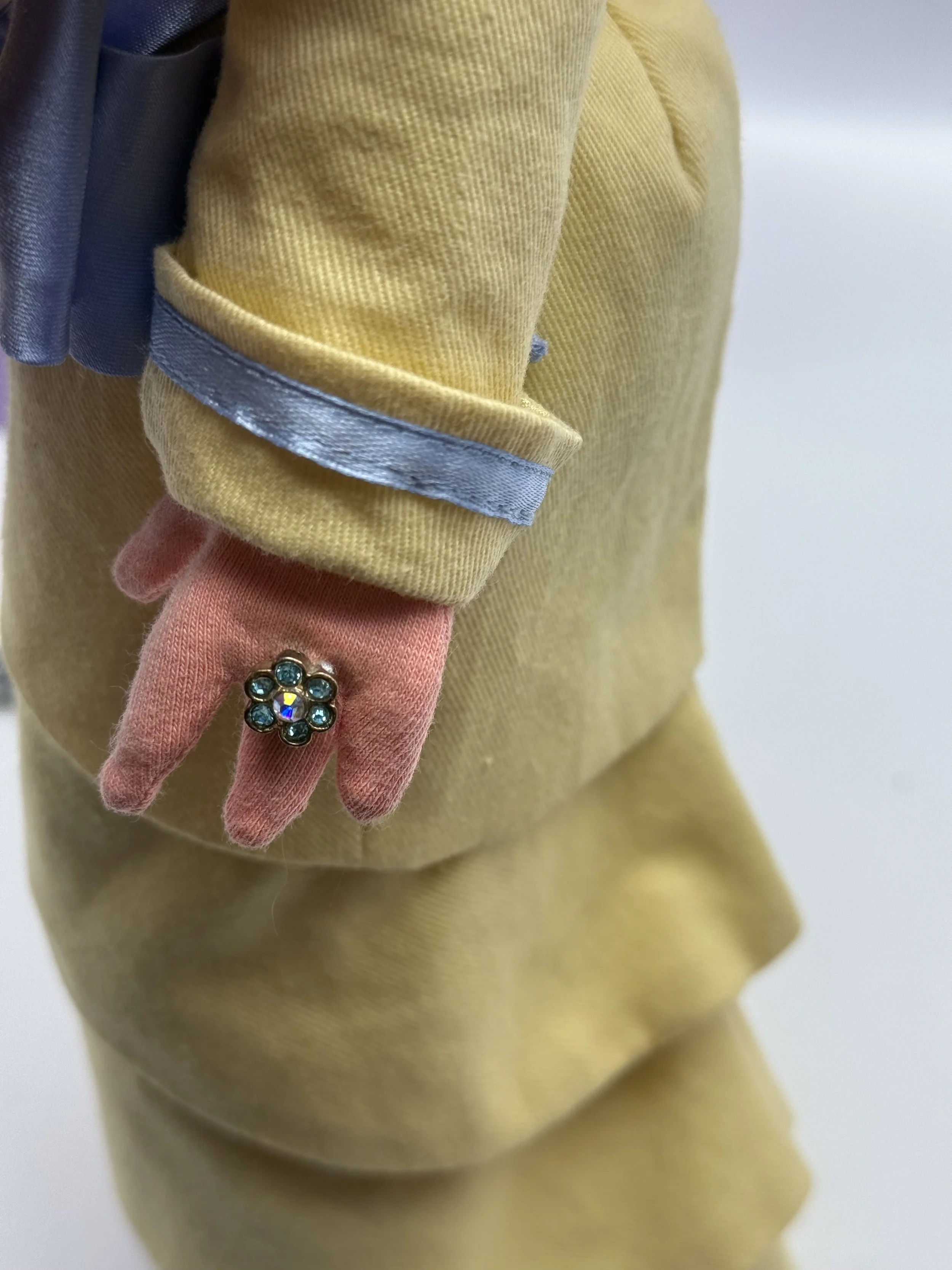 Close-up of Miss Piggy's ring and glove