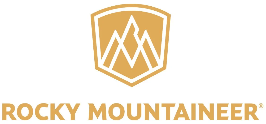 Rocky Mountaineer logo with gold mountain emblem and text.