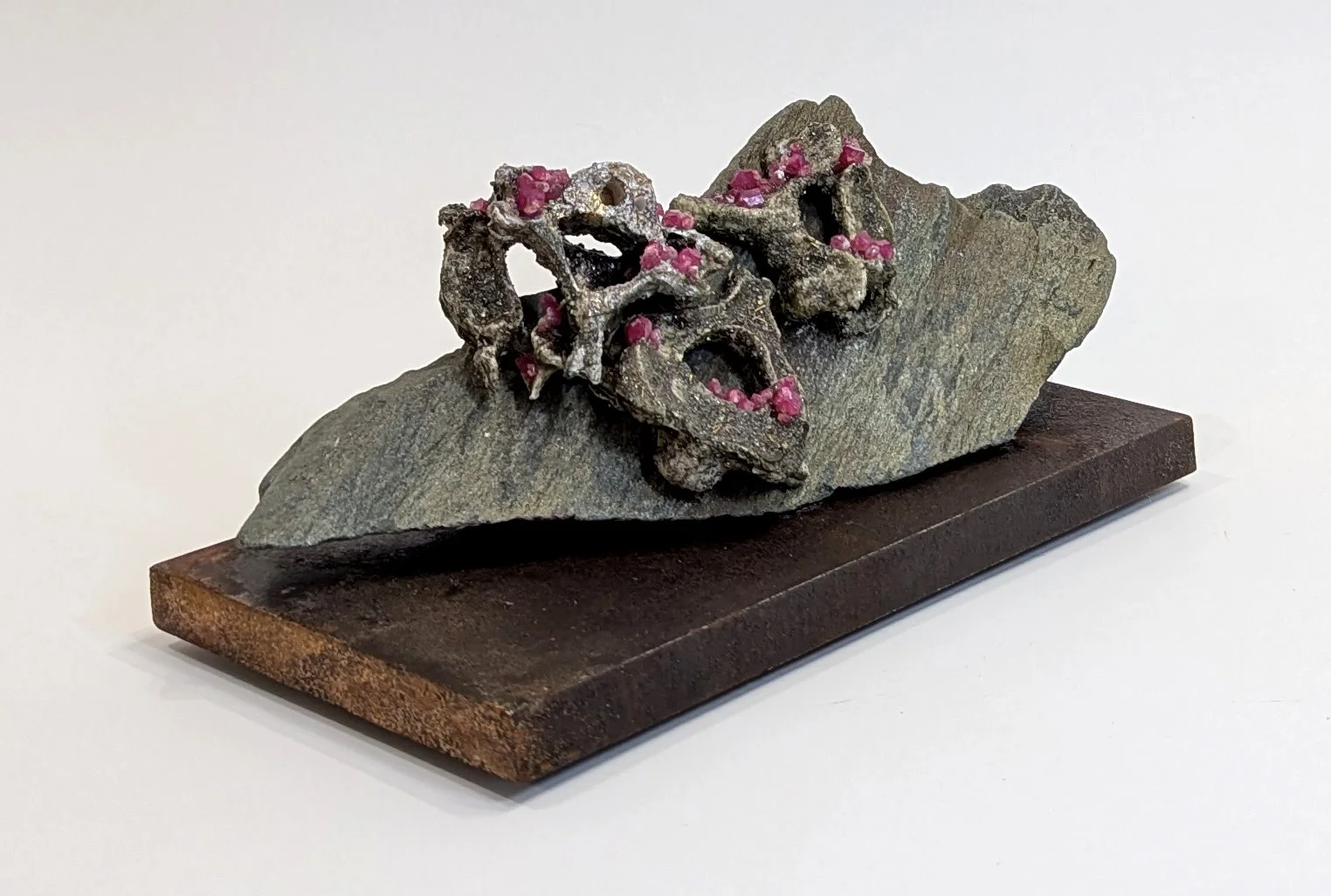  Reclining - 2025 - 4 x 8 x 4 1/4 - Hydrostone, Rubies,  Hematite, Silica, Titanium, Pyrite and Slate from Aylen Lake, ON 
- inquires: info@sivarulrasa.co