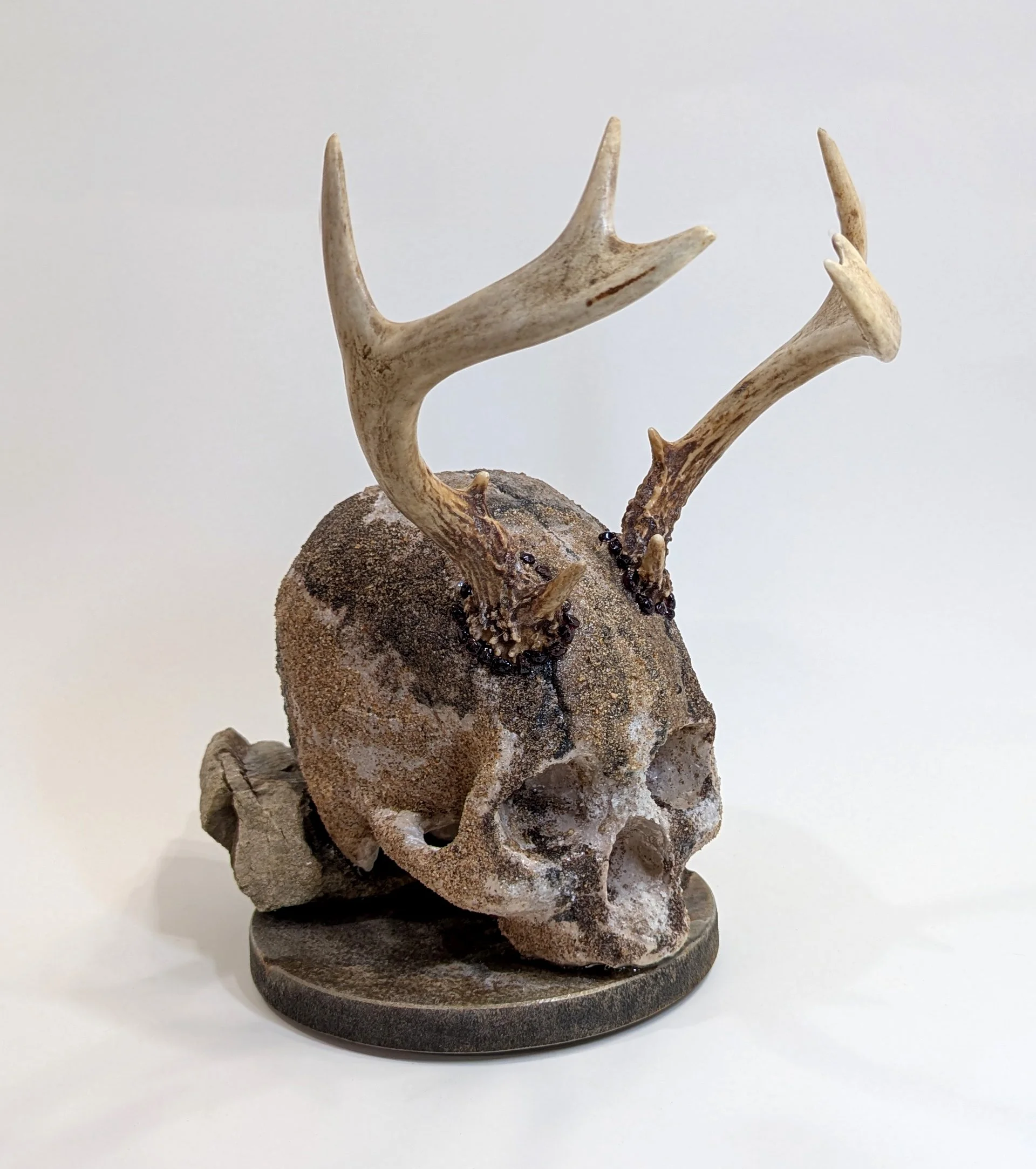  Wild One - 2025 - 12 x 10 ½ x 7 - Hydrostone, Antlers, Garnets, Sedimentary Rock from the Canadian Shield, Sands from various locations in Canada - inquires: info@sivarulrasa.com