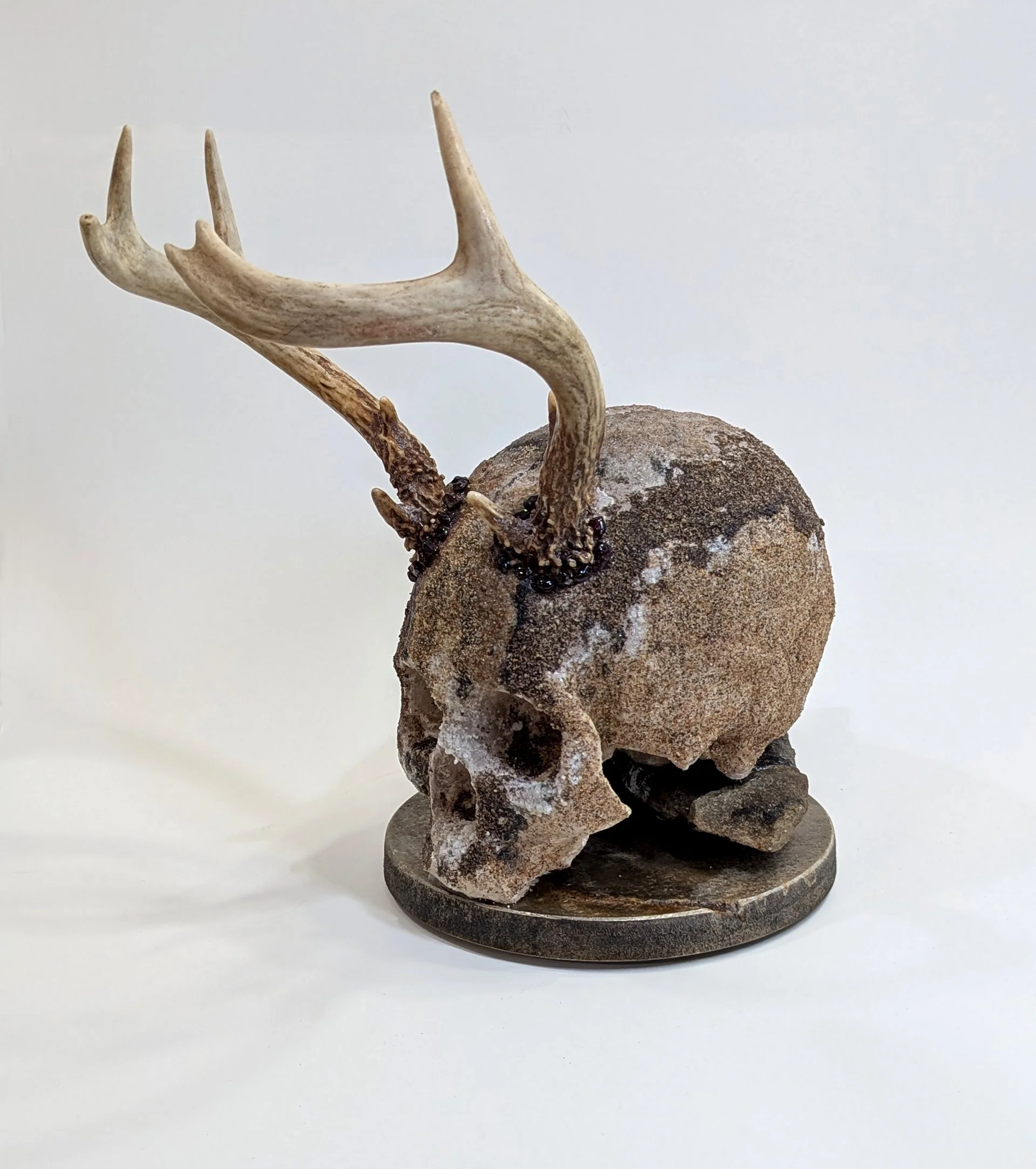  Wild One - 2025 - 12 x 10 ½ x 7 - Hydrostone, Antlers, Garnets, Sedimentary Rock from the Canadian Shield, Sands from various locations in Canada - inquires: info@sivarulrasa.com