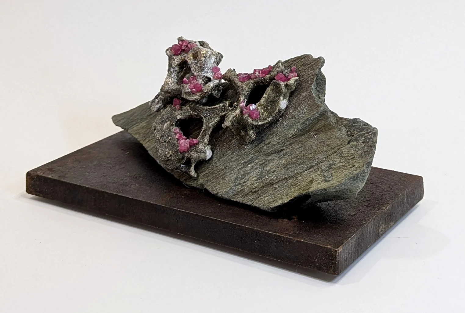  Reclining - 2025 - 4 x 8 x 4 1/4 - Hydrostone, Rubies,  Hematite, Silica, Titanium, Pyrite and Slate from Aylen Lake, ON 
- inquires: info@sivarulrasa.com