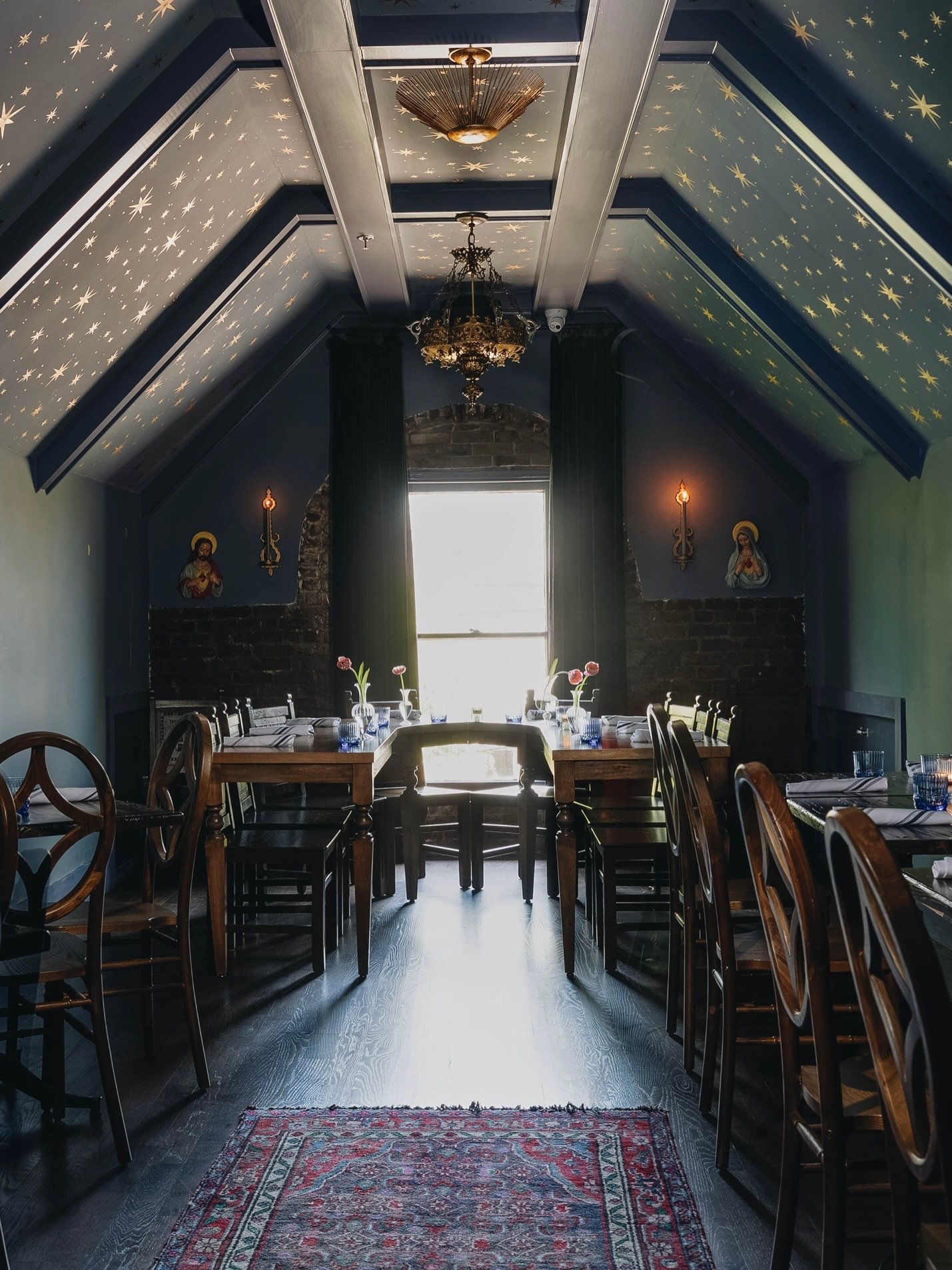 As featured on @we_heart 💫 
Design by @amandajacobsdesigninc 

@theholygrale is the kind of space that stays with you long after you leave. Layered, atmospheric and deeply experiential. 

Set within a historic church in Louisville, the project balan