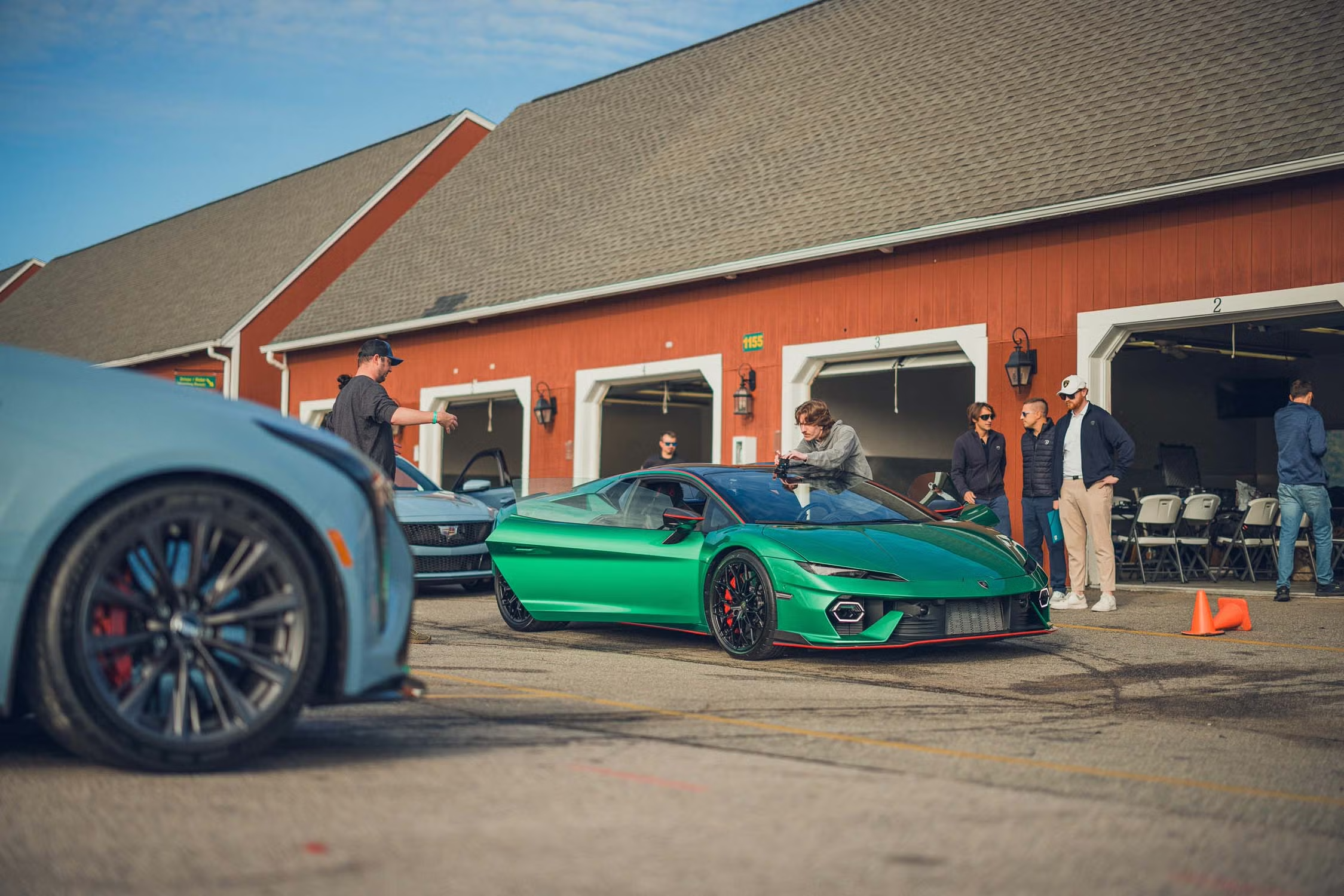 Green Lamborghini being prepared to go out on the track