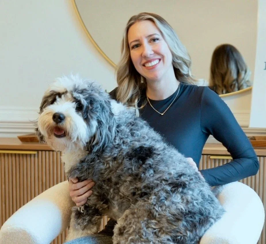 Close-up of an amber dropper bottle with a dropper releasing golden liquid into the bottle.
