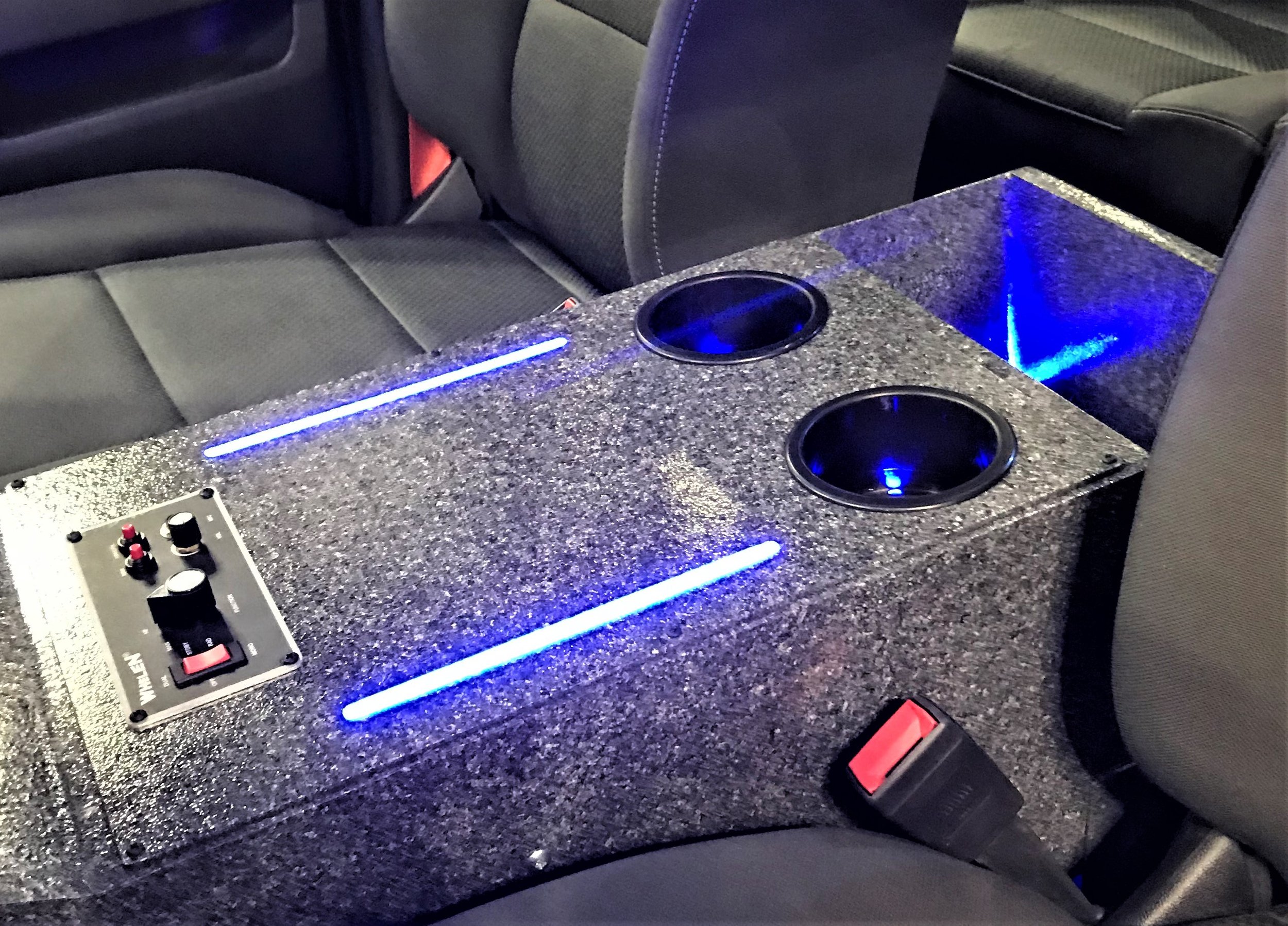 Blue Glow Tube in a center console of a ambulance. Blue Tape Light in the cup holder. Unique lighting designs.