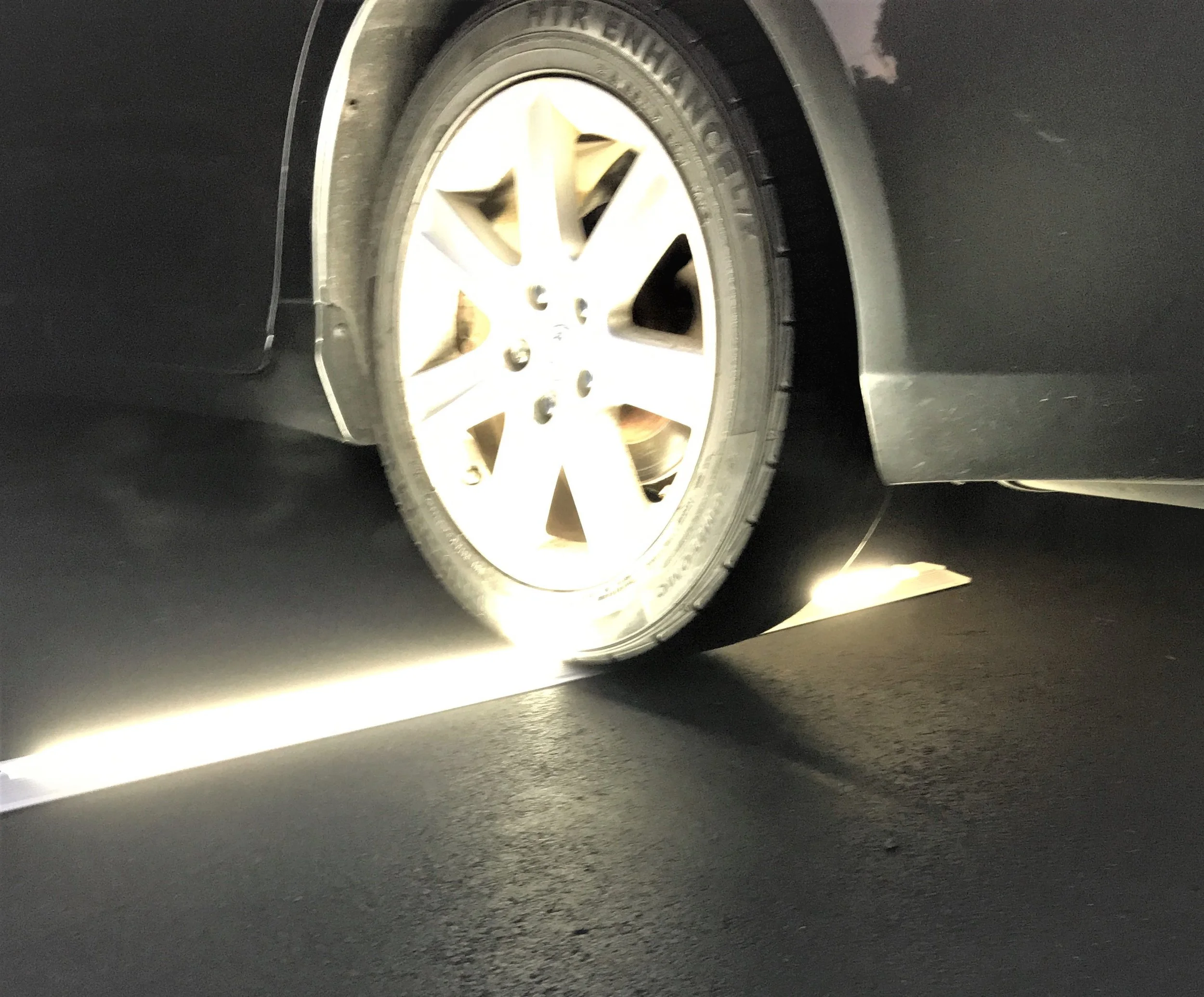 Car running over LED linear light with recessed lens. The light is not damaged and the lens is not cracked. The light is fully operational.