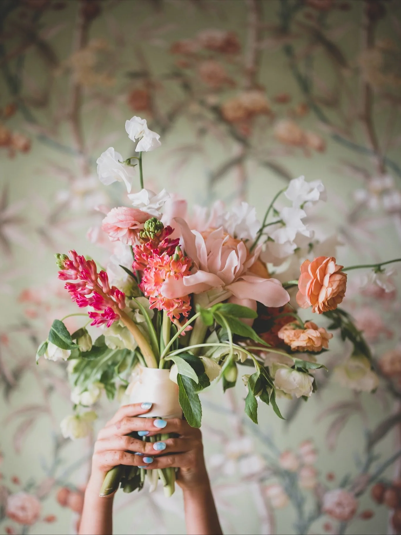 you see: a pretty photo ✨

I see: the bride's niece playing &quot;bride&quot; with the bouquet before the wedding ceremony, ready with anticipation for her role as flower girl, hair done, perfect dress chosen, in a very special place to their family.