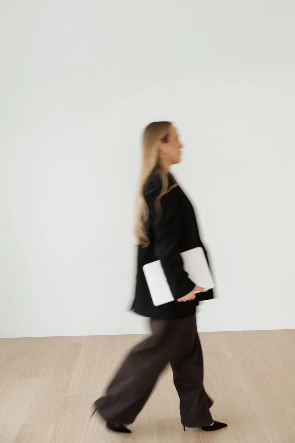 A Visibly manager on the move with her laptop