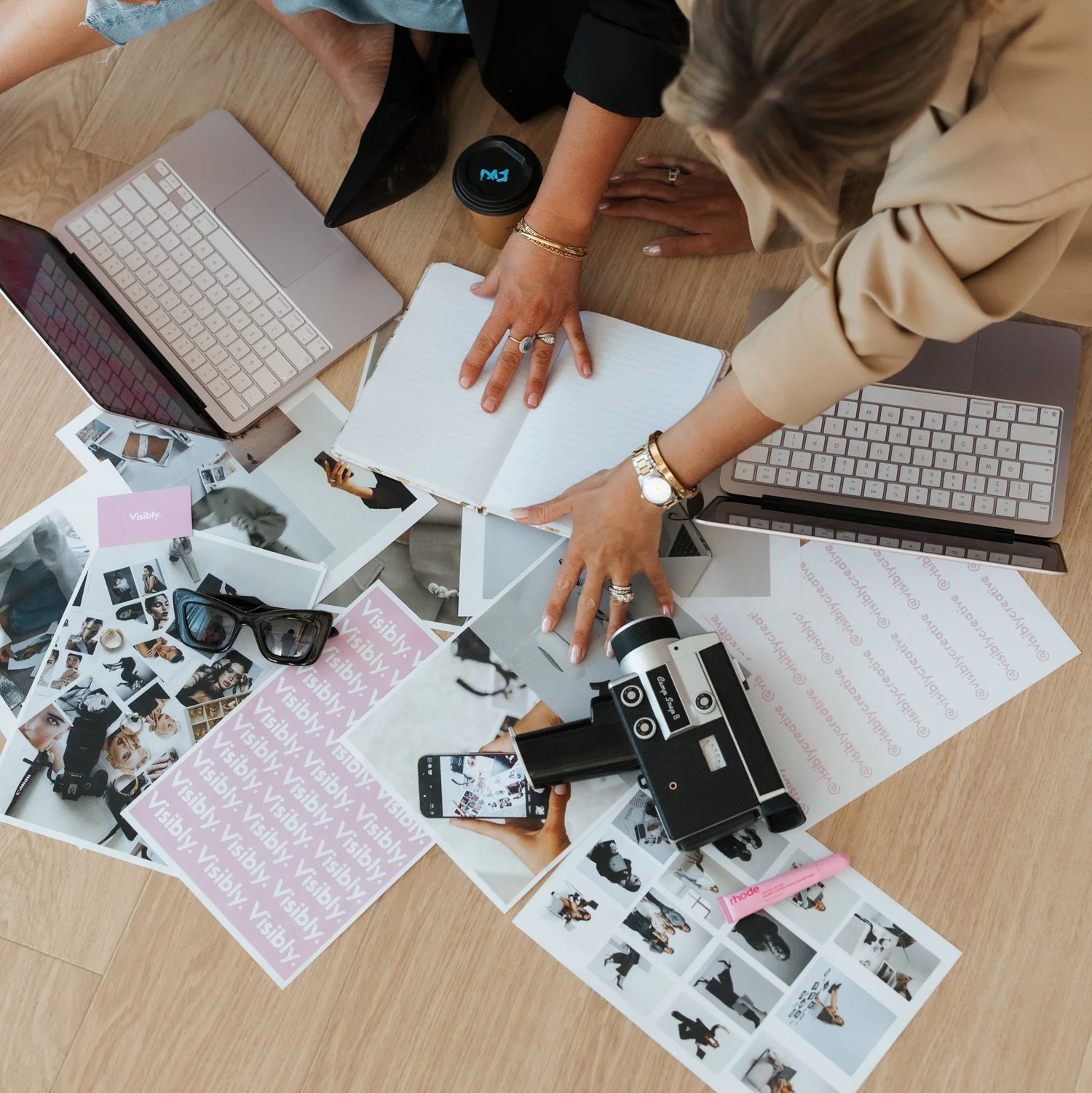 Coffee, Visibly cards and campaign moodboards on the studio floor