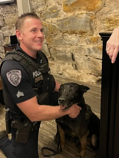 Officer with Black Doggie.jpeg