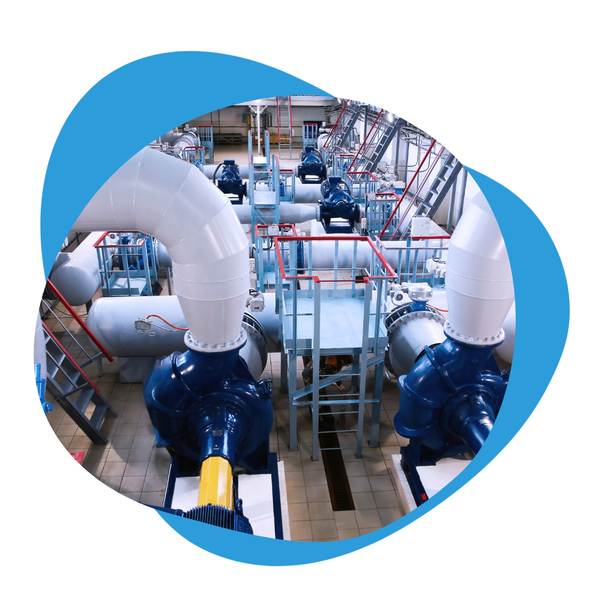 Interior of a water pump station with large pumps and pipes, illustrating SCADA-monitored pump station operations.