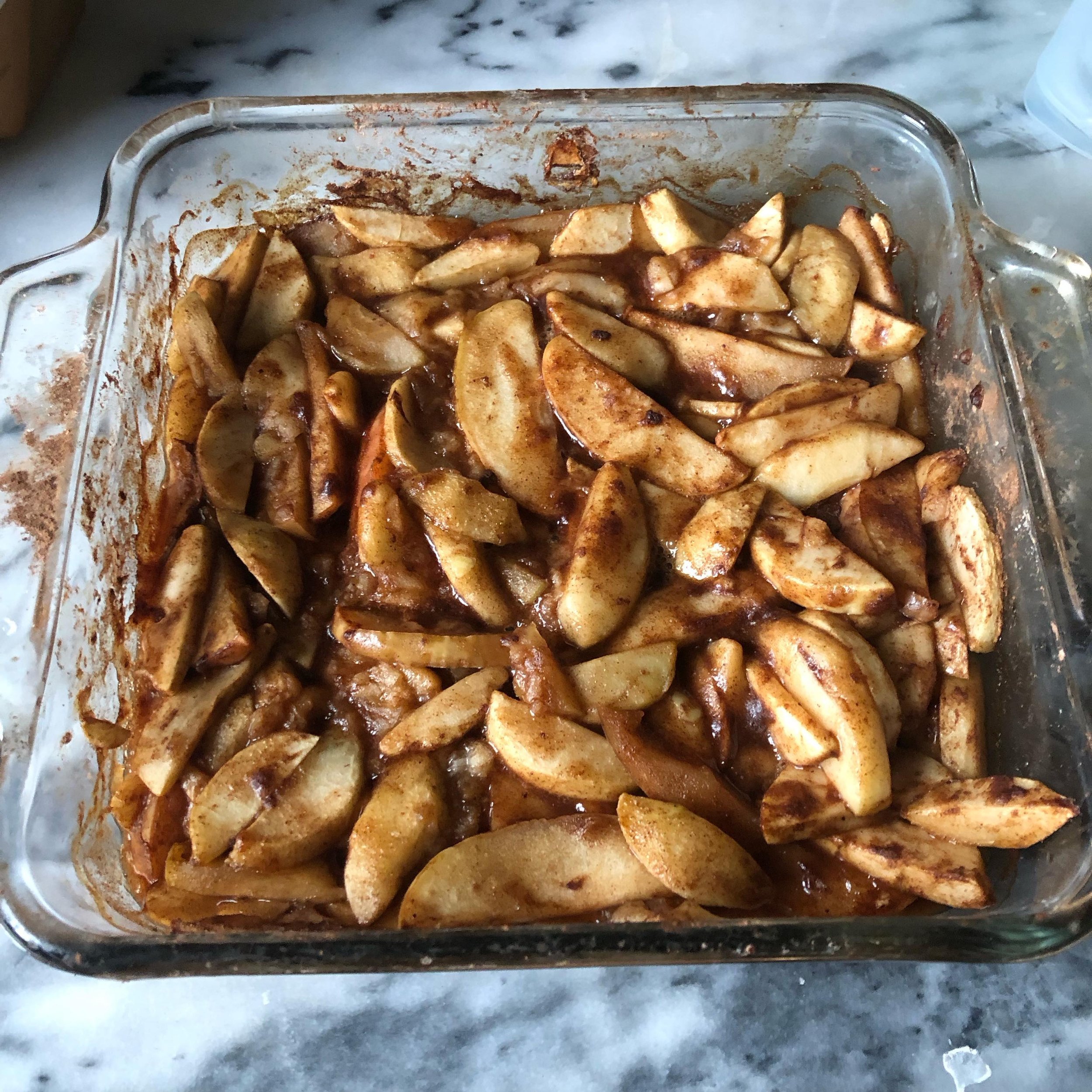 Baked Cinnamon Apples

6 large apples, sliced (no need to peel) or enough to almost fill an 8&rdquo; x8&rdquo; baking dish
2 Tbsp lemon juice
2 Tbsp coconut sugar or maple syrup 
1 round Tbsp arrowroot powder 
2 tsp cinnamon 
1/2 tsp ground ginger
1/