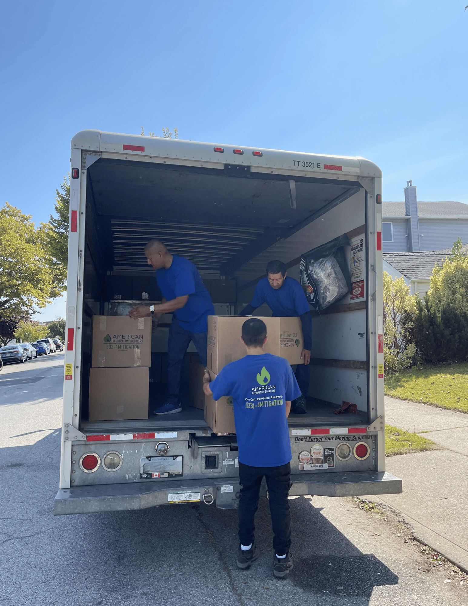 Restoration company packing and storing boxes and belongings