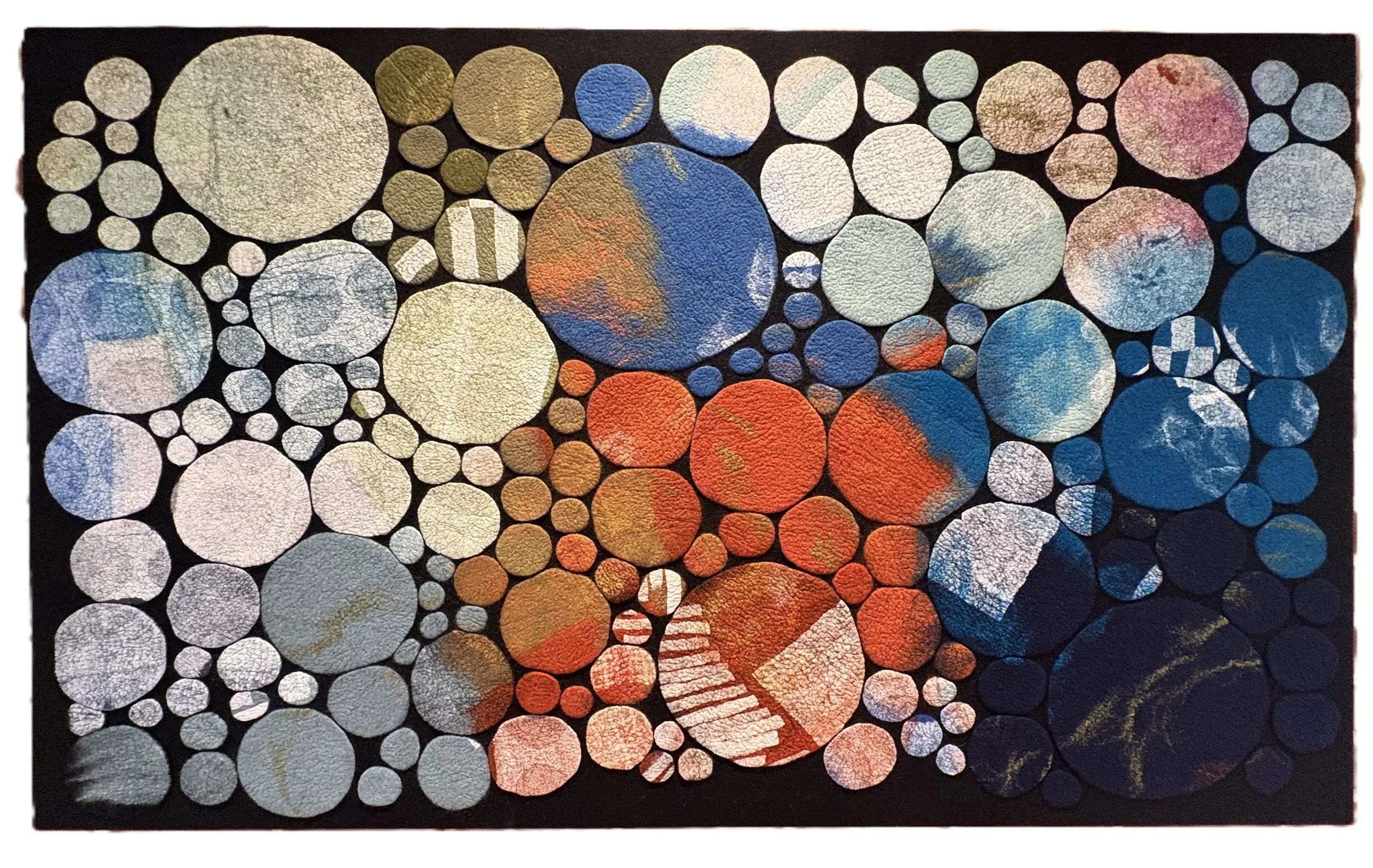 CIRCLES 1, 2025. 50"x30".  Wool, paper, plant fibers.