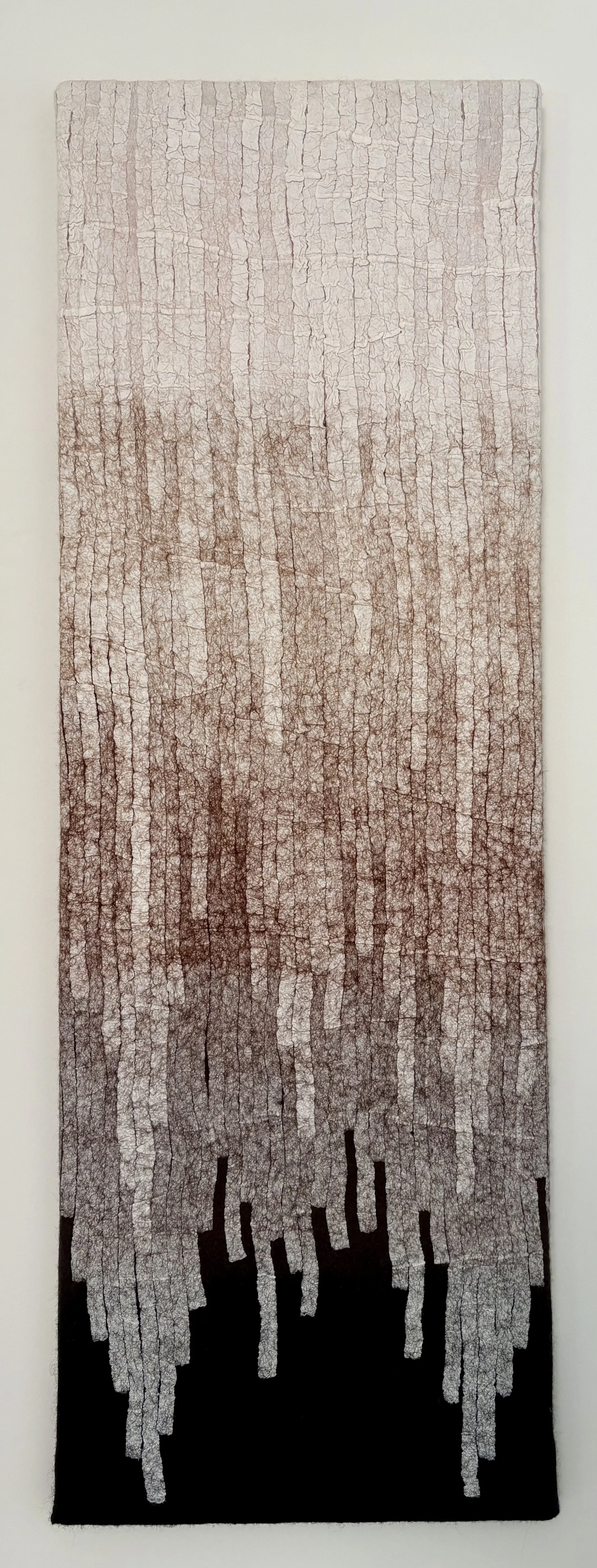 MIGRATION, 2021. 12"x36".  Wool, kozo paper.