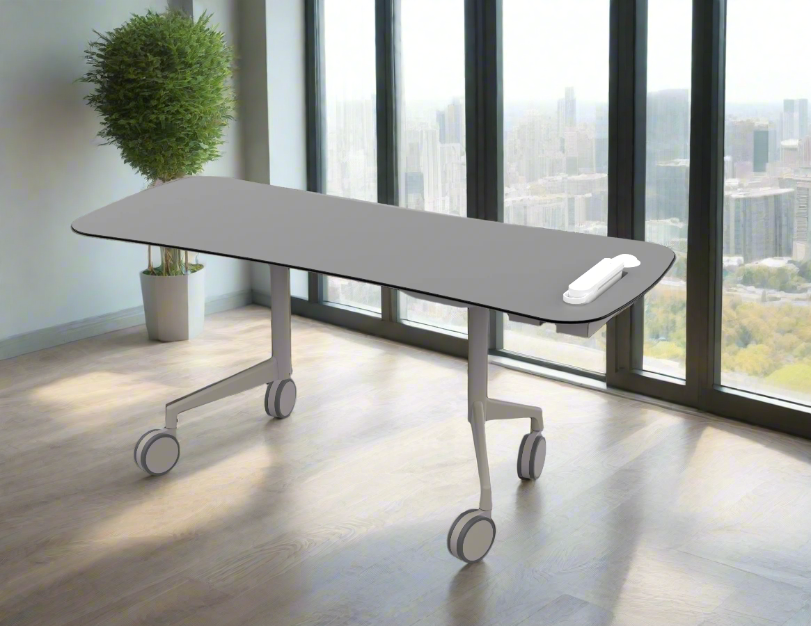 Modern hospital or office utility table with a telephone on it, in front of large windows overlooking a city skyline, and a potted plant in the corner.