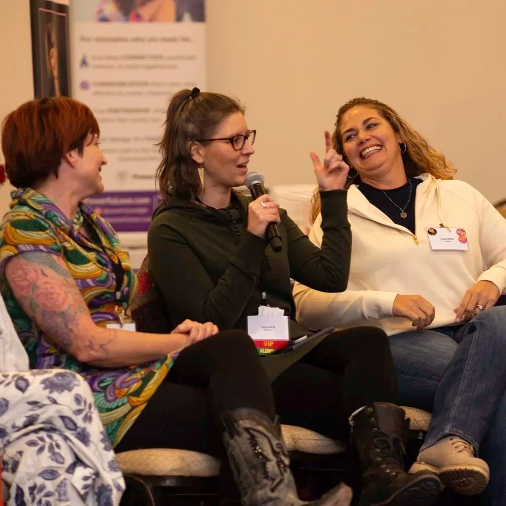 Jess speaking with two clients and female founders