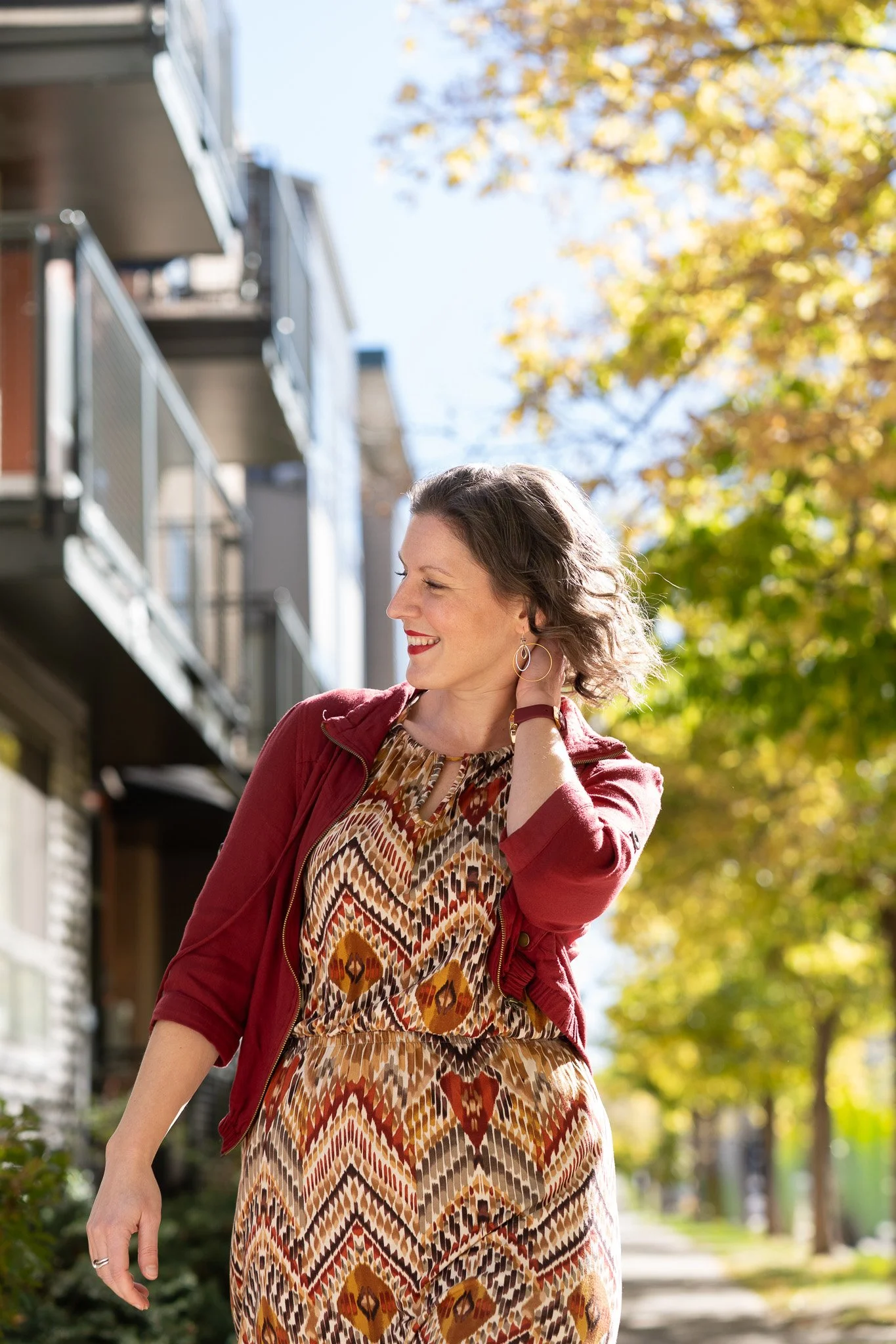 Jessica Millhiser, business consultant, smiling as she walks.