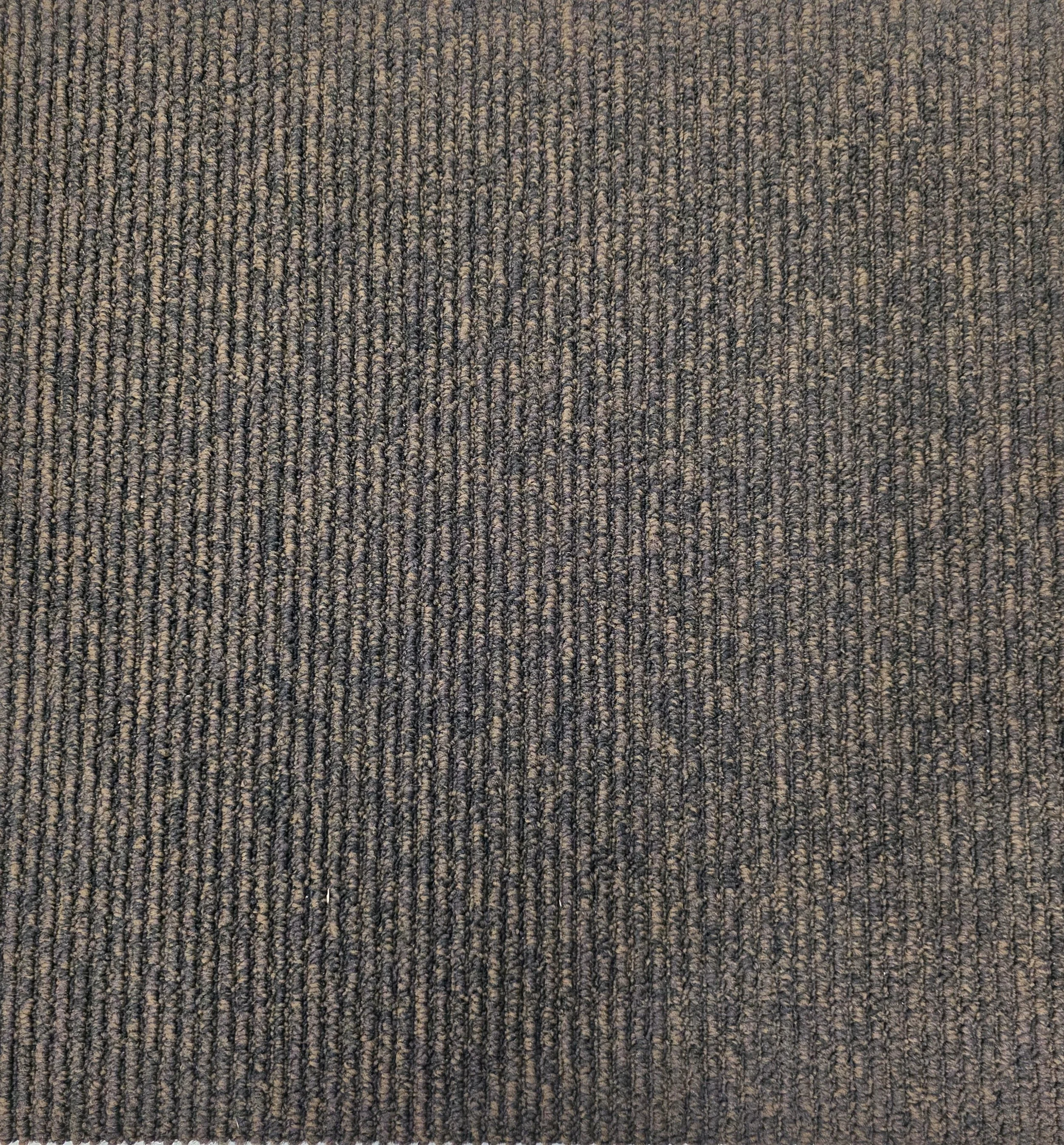 Close-up of a textured, dark-colored carpet with a loop pile weave pattern.
