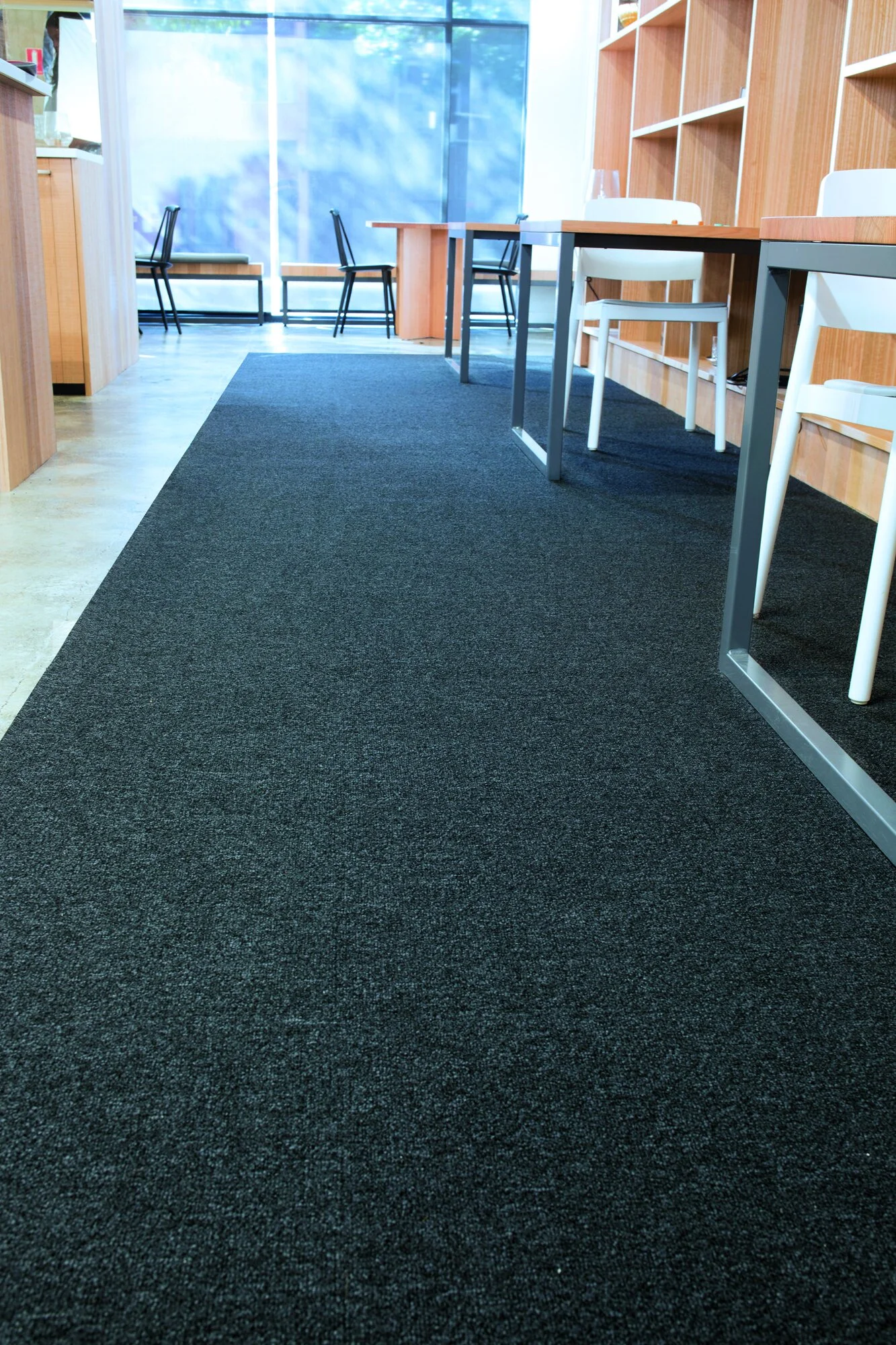 Close-up of a dark textured surface with scattered lighter specks and patches.