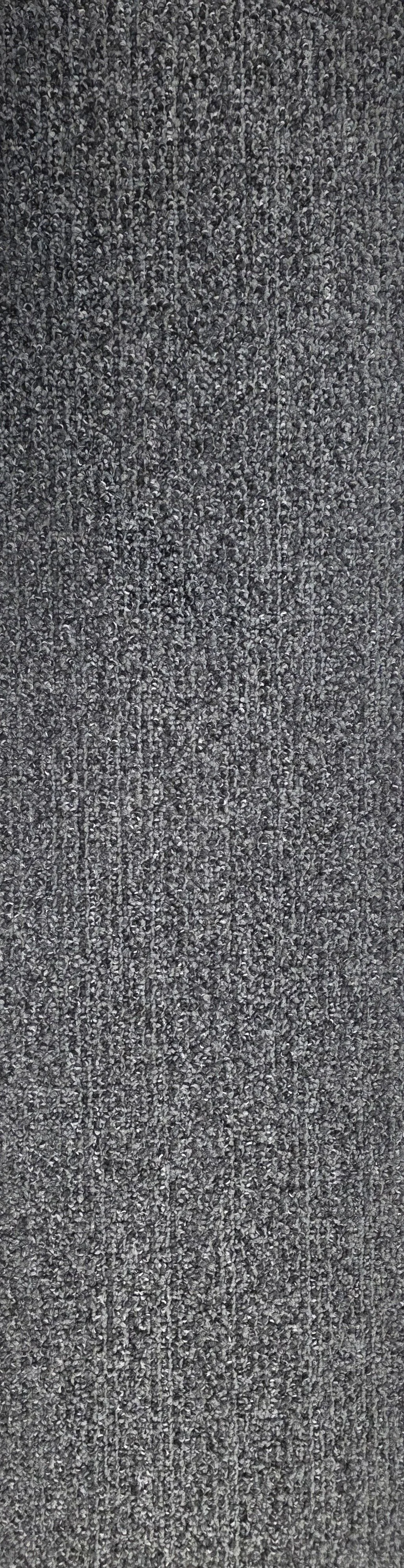 Close-up view of a gray, textured carpet with a patterned weave.