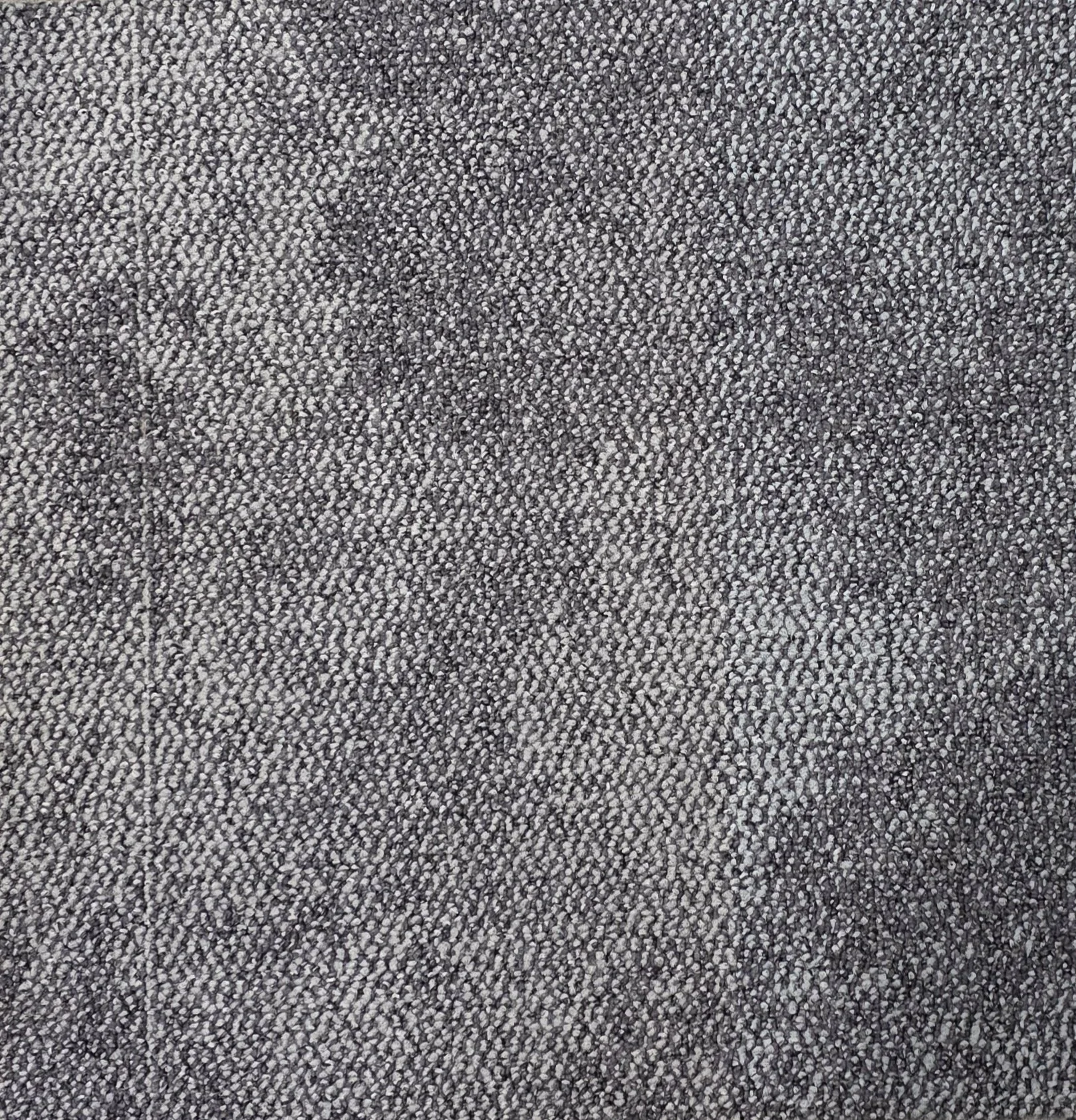 Close-up of a textured gray fabric surface.