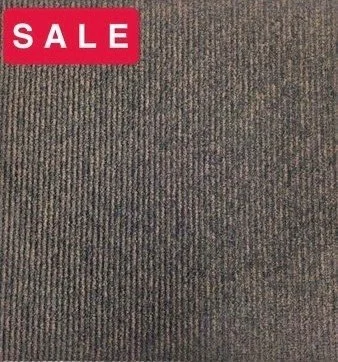 Close-up of a textured, dark-colored carpet with a loop pile weave pattern.