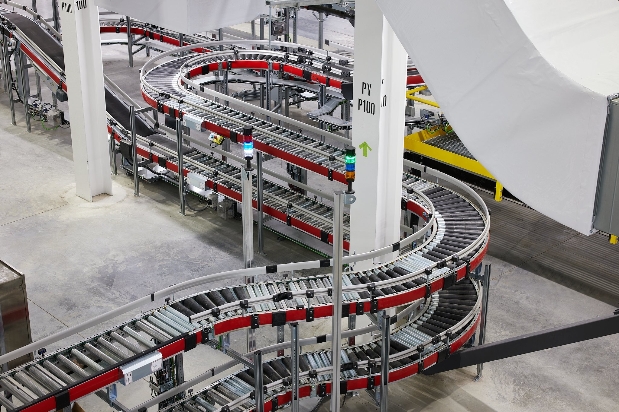 Industrial production facility at Voila company showing rollers and manufacturing equipment inside the production building
