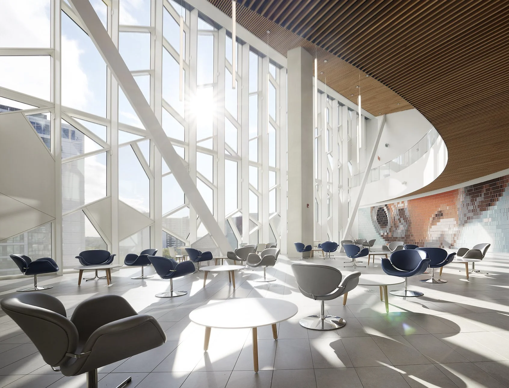 Calgary Library Detailing the architecture in the wood ceiling with tall windows with lots of light