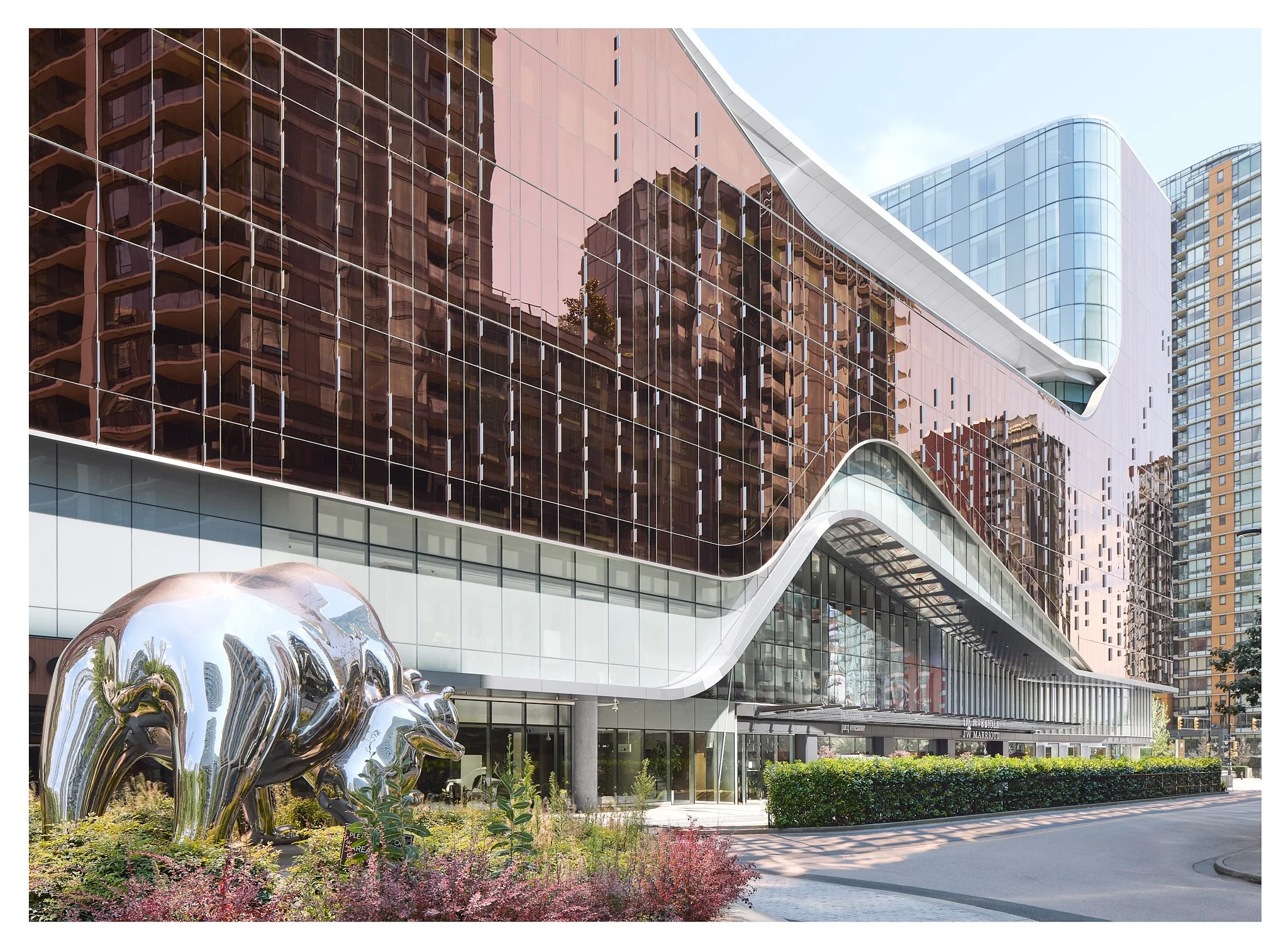 Architectural close-up of The Douglas Hotel glass facade showing modern design detail and reflective exterior materials
