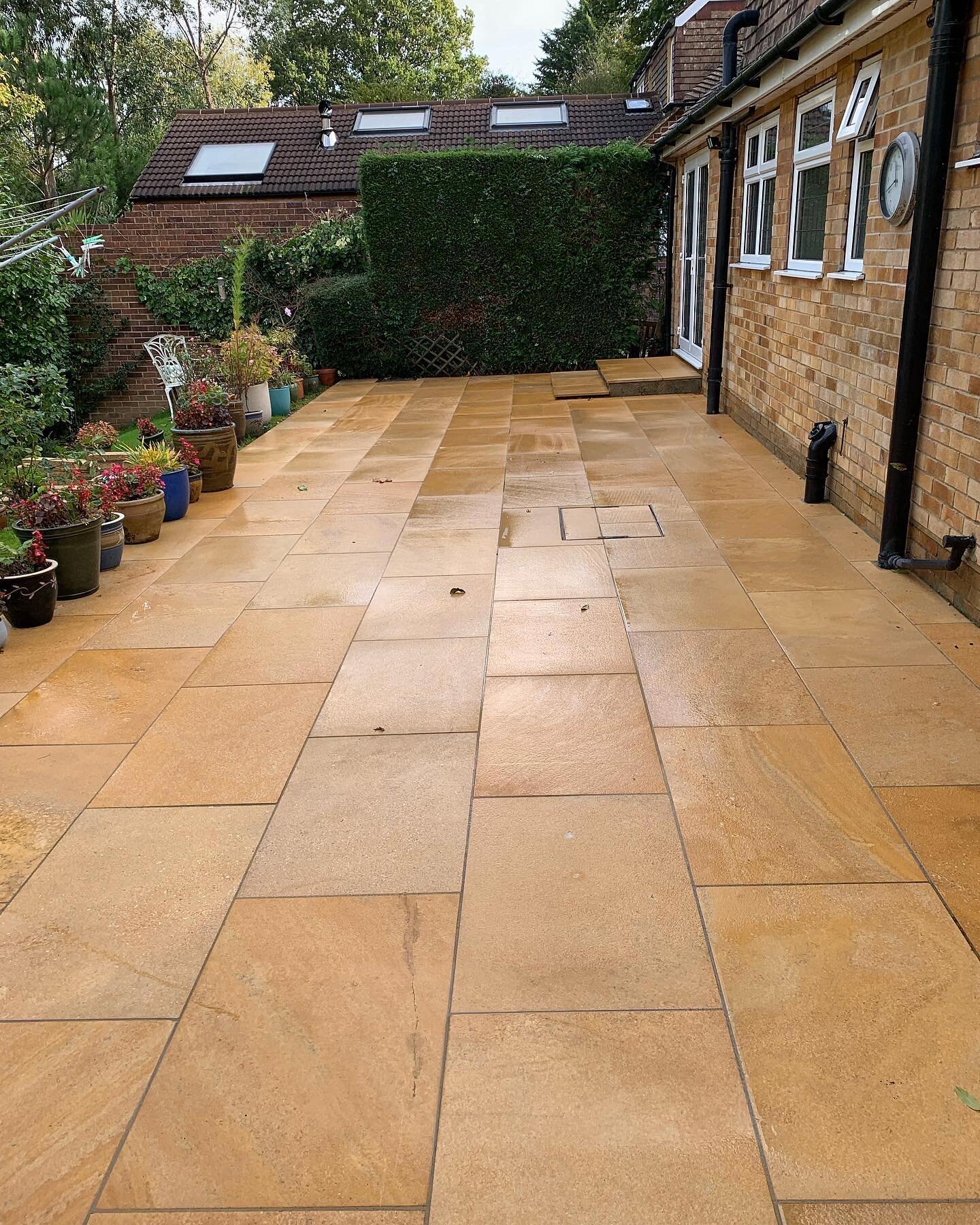 Sandstone patio cleaned and restored to its natural colour for this elderly client. Removing the embedded algae / dirt will ensure the patio is less slippy in the winter!