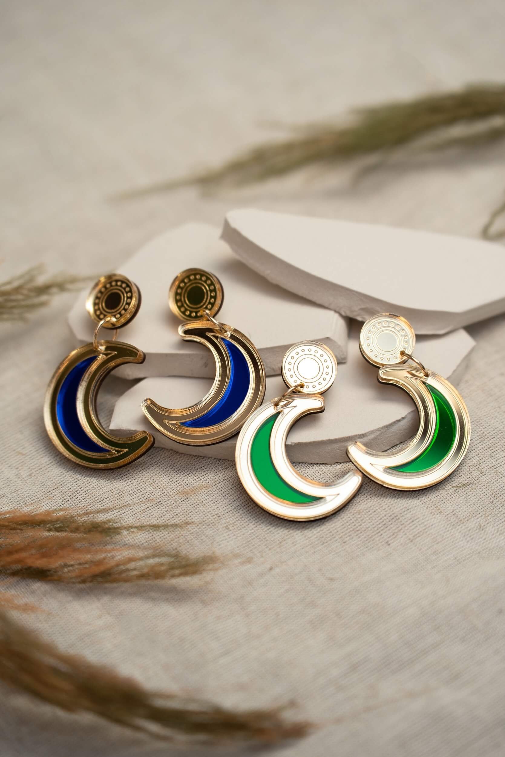 laser-cut acrylic crescent moon drop stud earrings in mirror gold and emerald green and royal blue