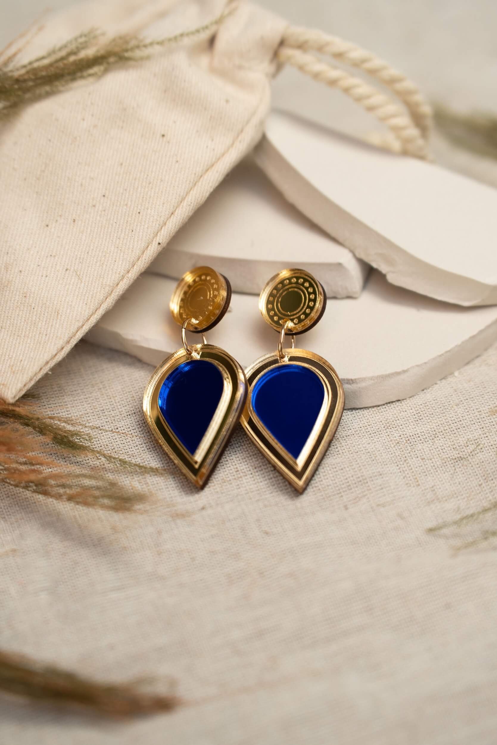 laser-cut acrylic teardrop drop stud earrings in mirror gold and royal blue
