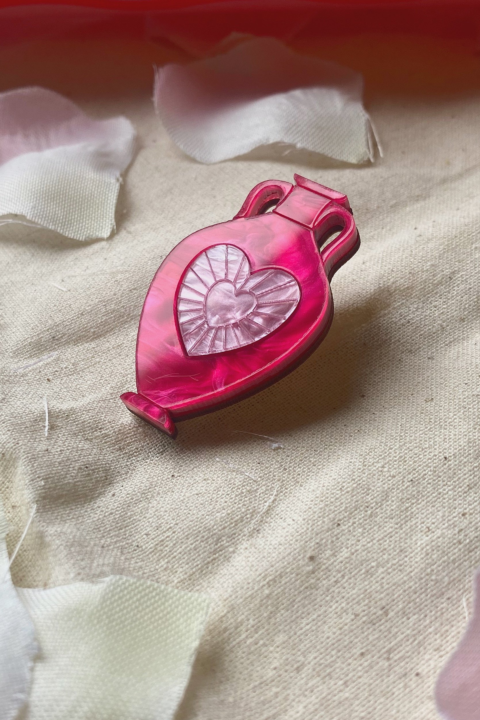 side-closeup-heart-amphora-brooch-platos-fire.jpg