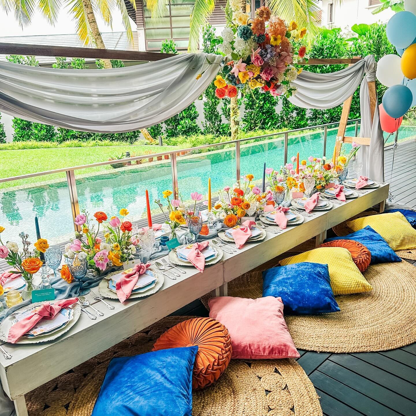 Let&rsquo;s celebrate with flair! Our exquisite picnic arrangement for a Sweet 16 birthday bash dazzled in shades of blue, accented with vibrant bursts of colour! From opulent florals to graceful tapered candles and lively cushions, each element was 