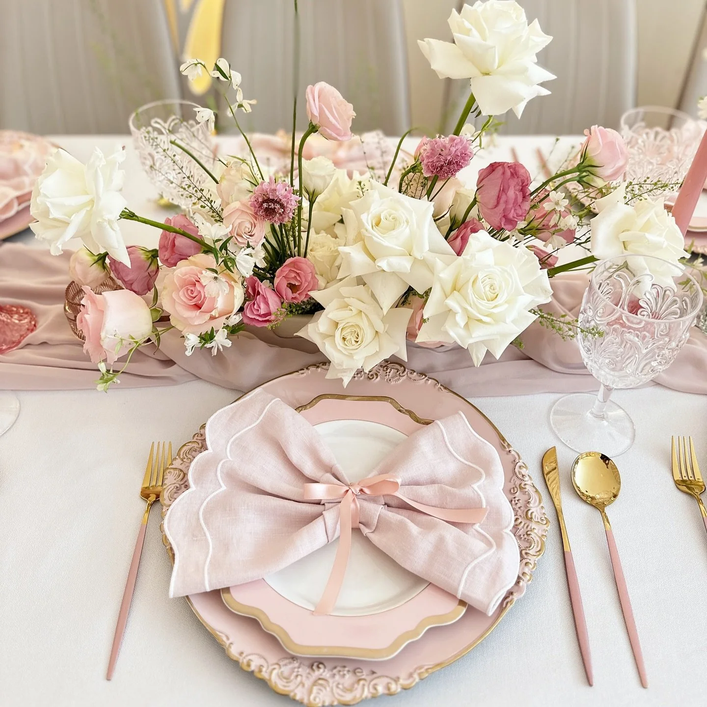 Soft blush tones, graceful curves, and elegant textures &mdash; this setting is pure sophistication. From the delicate bow napkins to the dreamy balloon and ribbon backdrop, every detail whispers refined romance. 💕 Perfect for an intimate celebratio