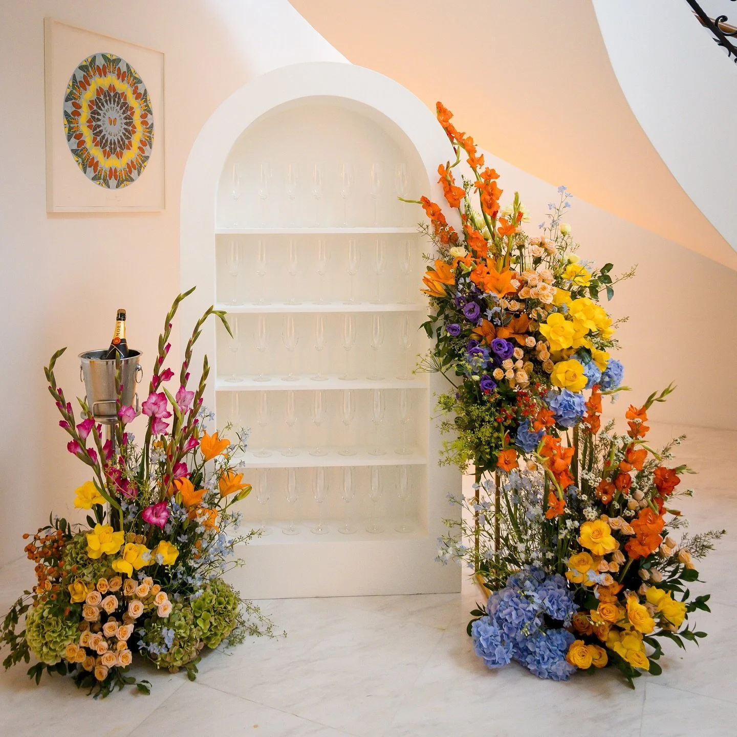 When floral artistry meets celebration, magic blooms. Our champagne wall isn&rsquo;t just a feature &mdash; it&rsquo;s a moment, a conversation starter, a photo-worthy corner that gets everyone talking 🥂✨

Set against elegant architecture and bursti