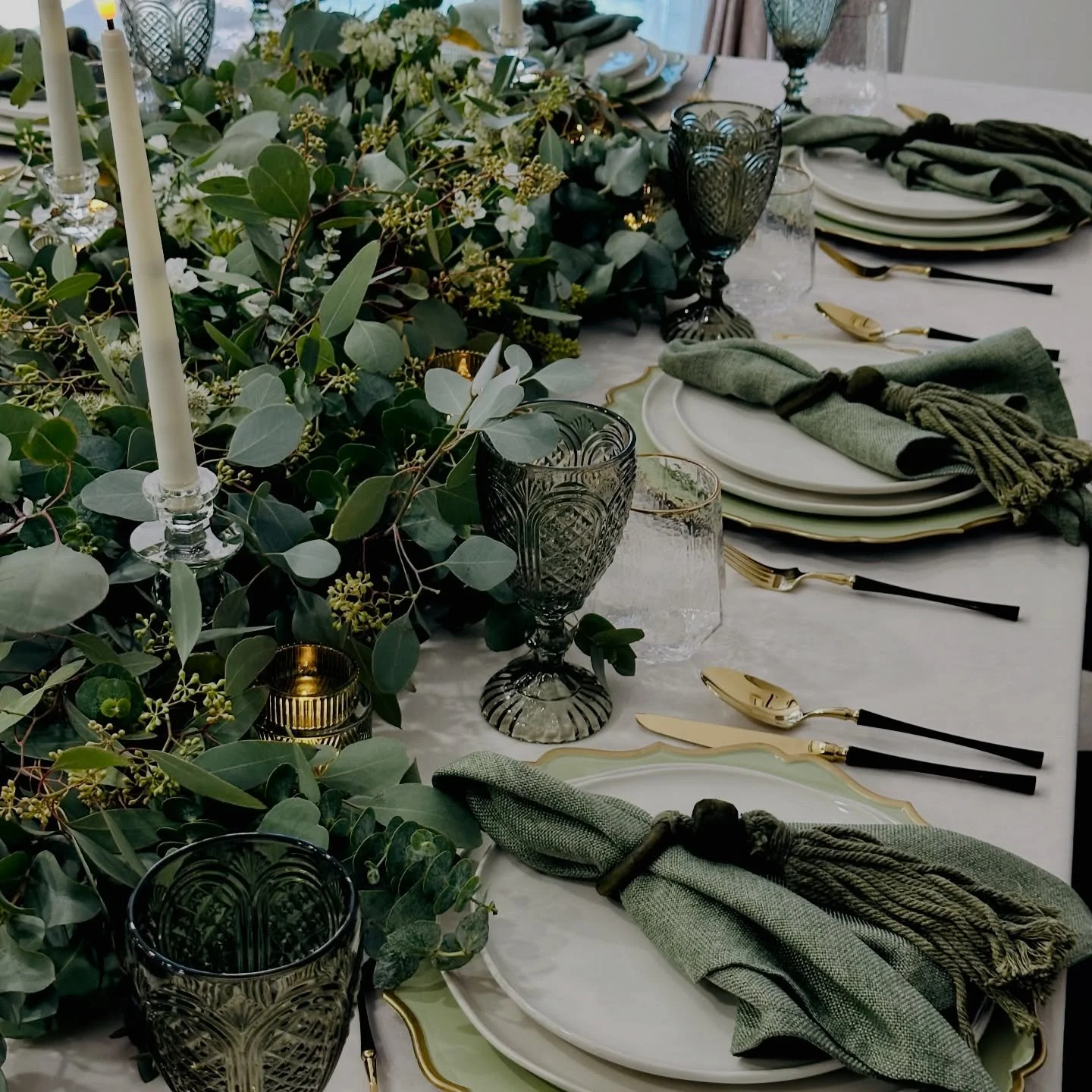 The Grange &mdash; a celebration of refined simplicity and effortless style.

Your events reimagined with understated luxury and botanical elegance.

This tablescape features a fresh eucalyptus runner, minimalist tableware with sleek black detailing,