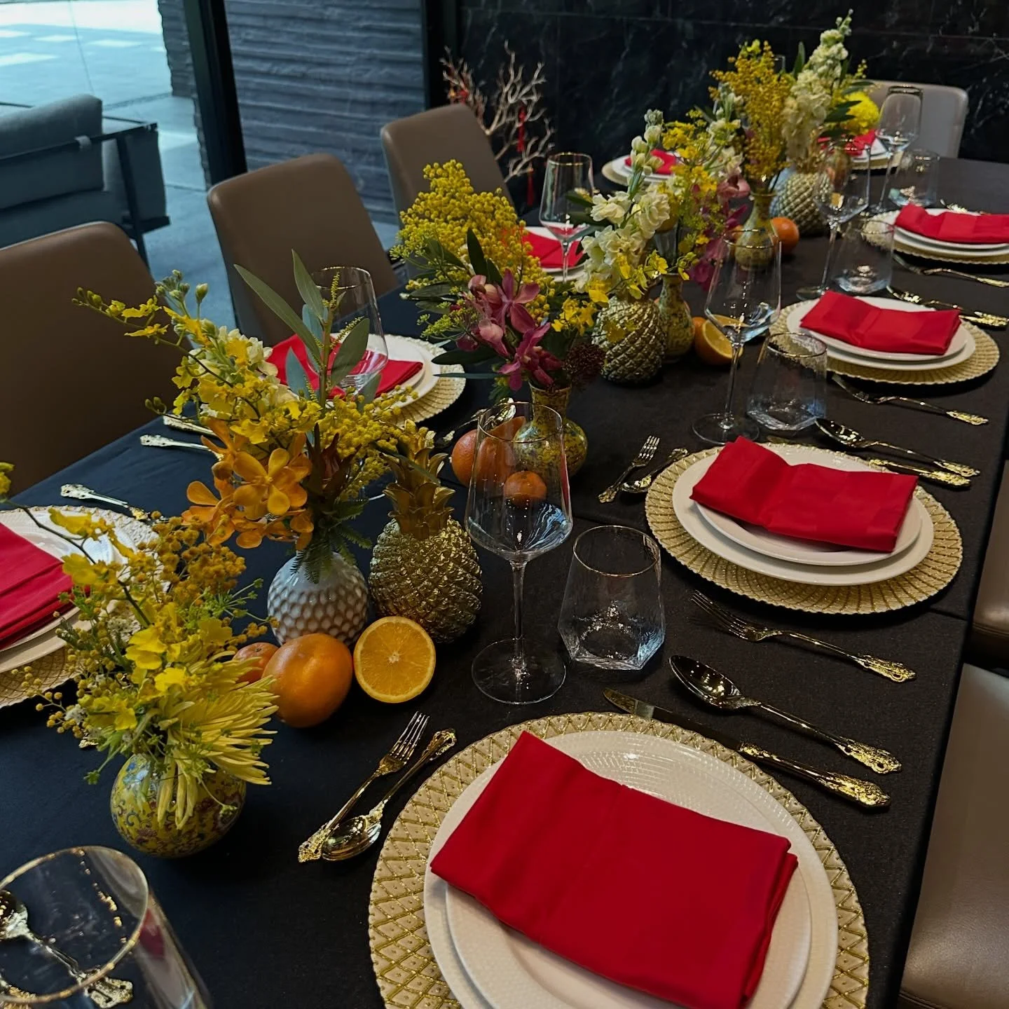 Bold reds, golden hues, and a sprinkle of prosperity 🍊🍍&mdash;this Chinese New Year tablescape blends tradition with style, creating a festive dining experience that speaks abundance and joy. From Chinese vases to symbolic fruits and florals, every