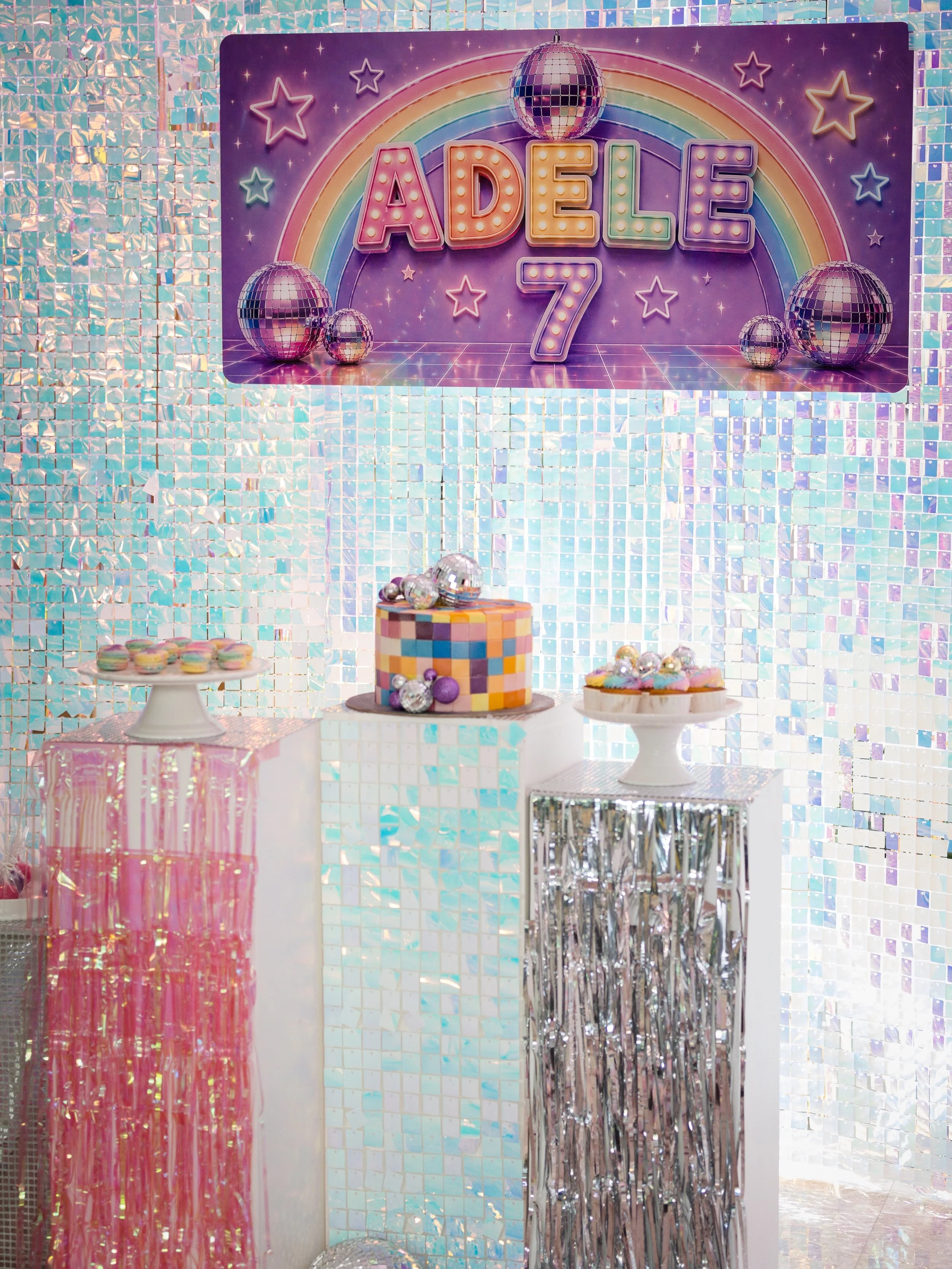 Rainbow shimmer, disco sparkle, and a party that truly shines! 🪩

This celebration was a full-on shimmer disco dream&mdash;featuring iridescent backdrops, pastel treats, and statement details at every turn. From the dazzling tinsel backdrop all arou