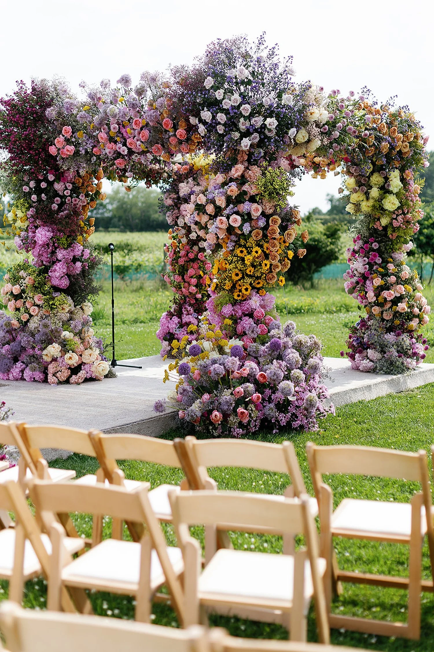  vibrant summer flowers decorate chuppah at outdoor wedding ceremony in the Hamptons at Parrish Art Museum 