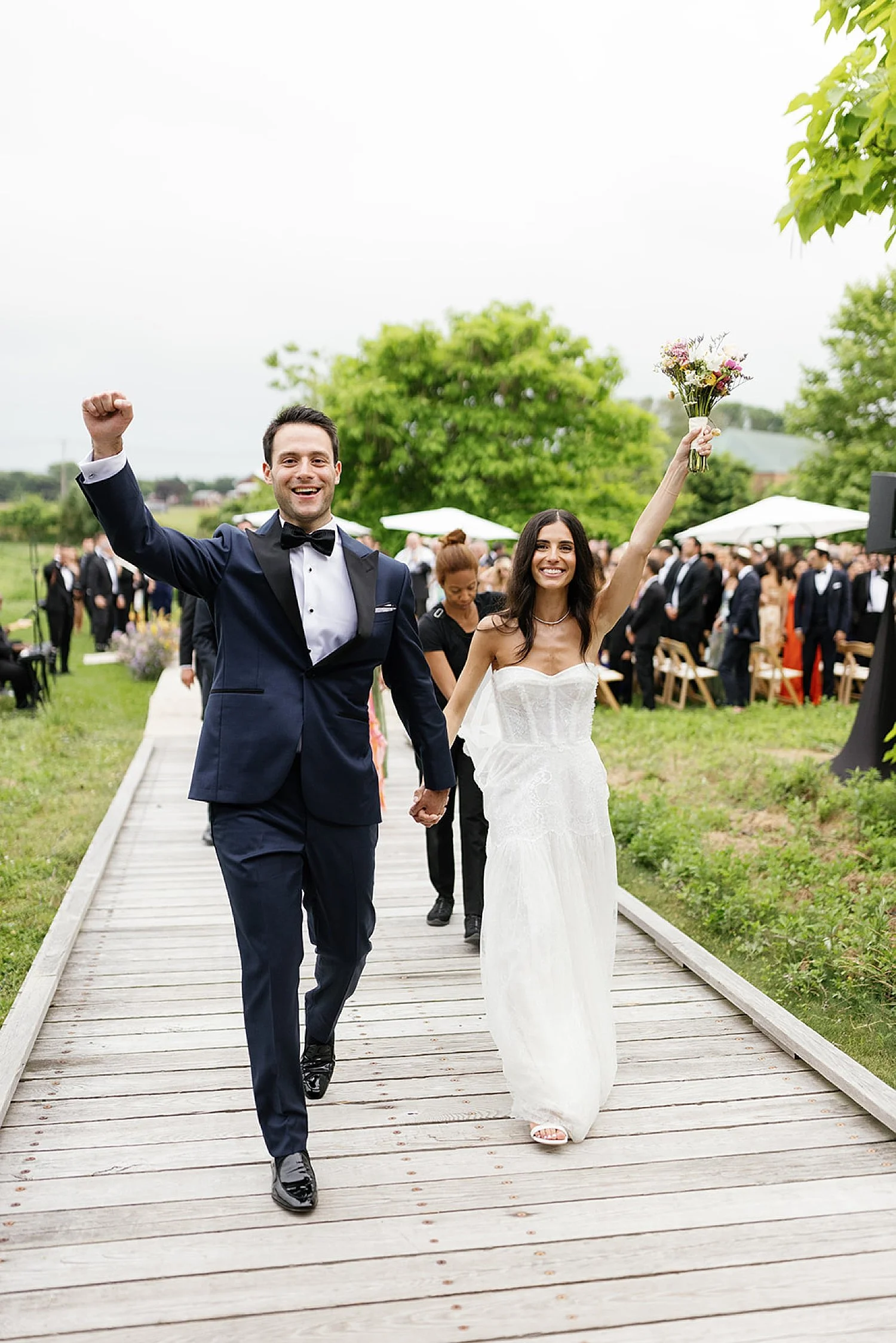  newlyweds exiting wedding ceremony in the Hamptons at Parrish Art Museum  
