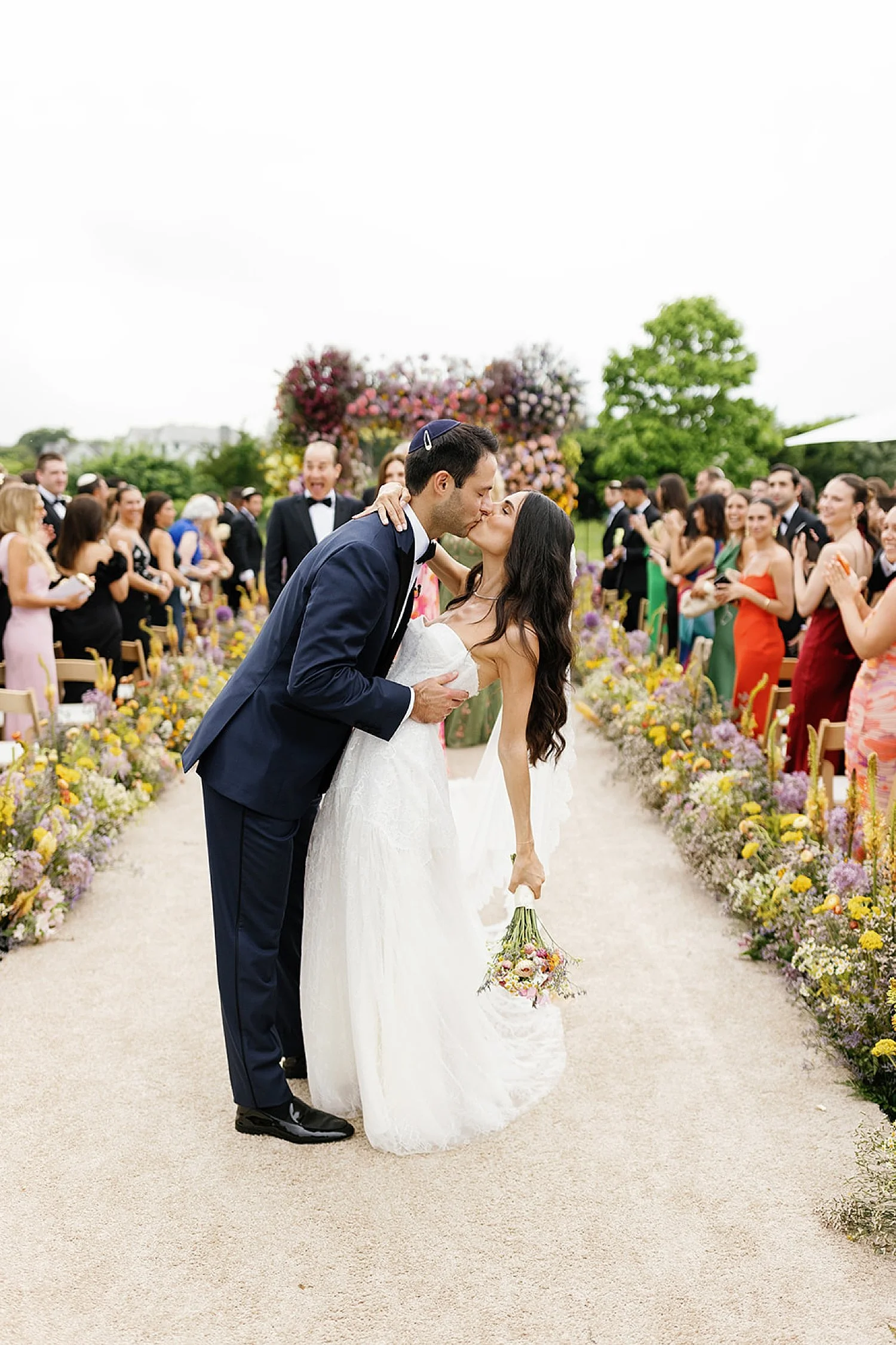  newlyweds kiss as they exit wedding ceremony  