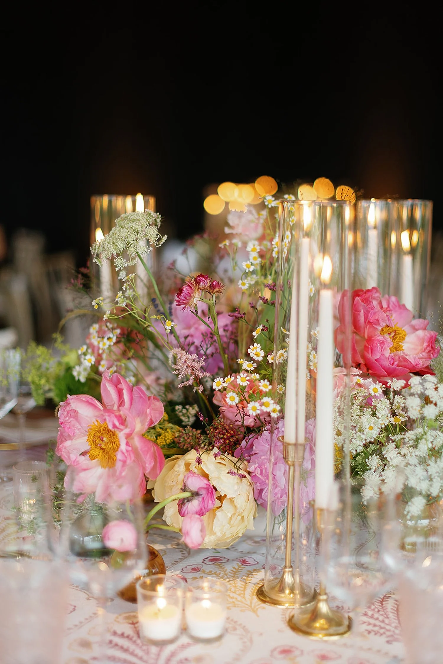  candlelight and summer blooms decorate tablescape 