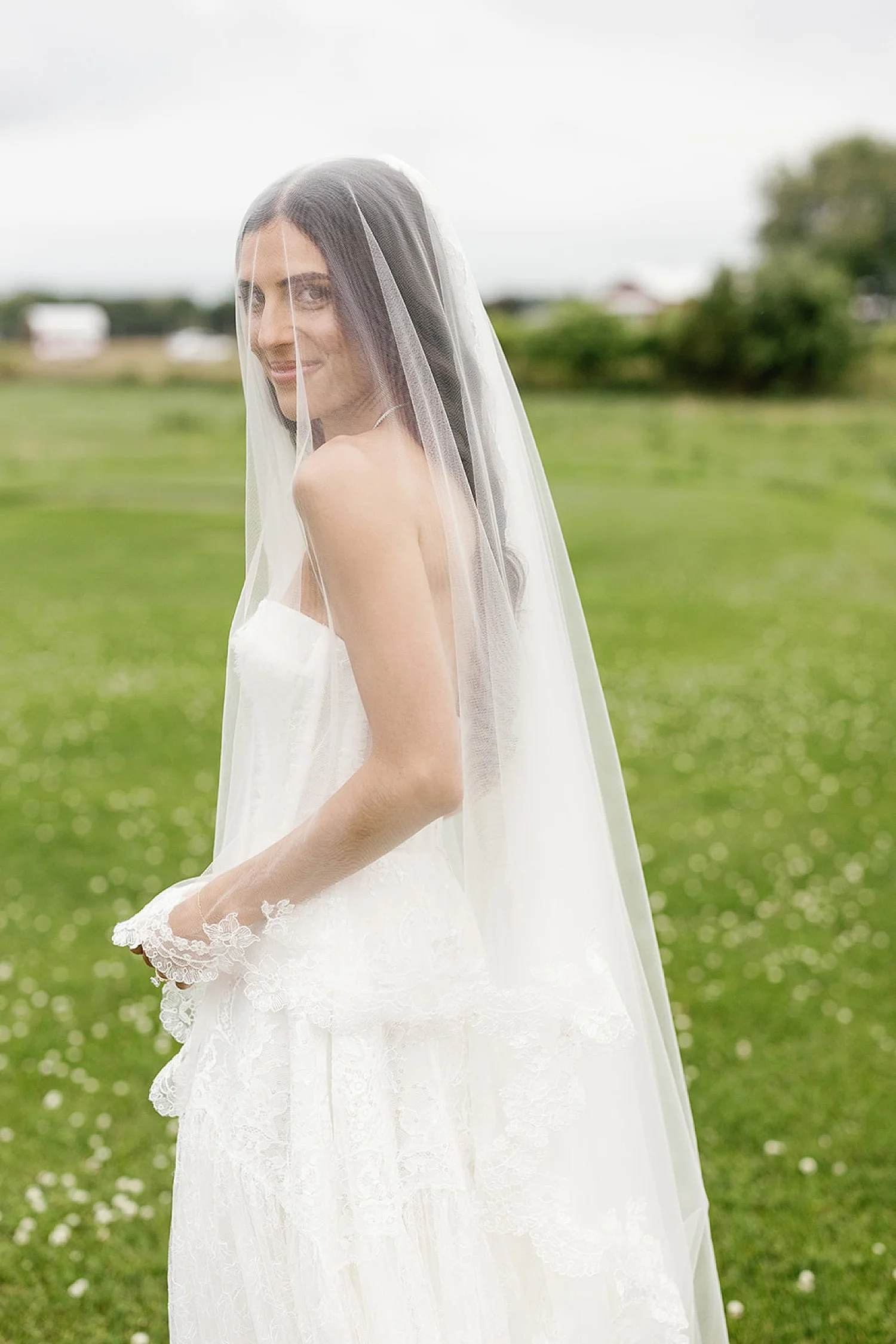  bridal portraits with veil over her 