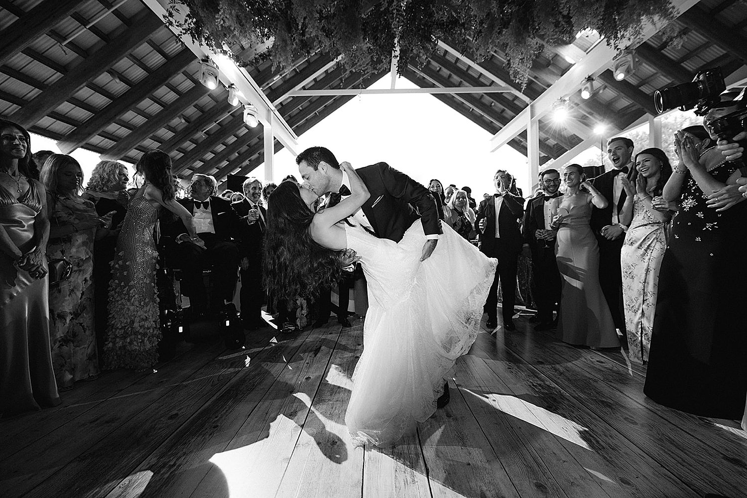  groom dips bride on the dance floor  